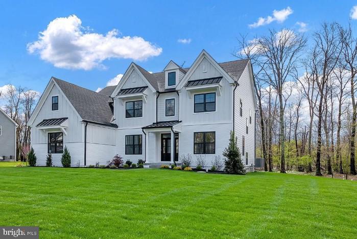 Superior location! Down the street from the Philadelphia Cricket Club, Erdenheim Farm and Fort Washington State Park walking trails, as well as walking distance to all that Flourtown has to offer! This new construction home built by Marc Salamone Homes sits on beautiful lot just shy of 1 acre in Colonial School District! The Brookside Elite, features include a Gourmet kitchen with large center island with quartz countertops, GE Café 36” slide in range, hood vented to outside, additional oven, microwave drawer, dishwasher, under cabinet lighting, under cabinet outlets, lighting in the upper glass cabinets and pantry closet. The kitchen and dining area open to the impressive great room with feature ceiling, a gas fireplace with remote and butler’s pantry with beverage center and sink. The main floor also features 9ft ceilings, formal dining and living rooms, a private study, a mudroom with access to the 3-car attached garage and driveway, convenient powder room, hardwood floors throughout the first floor. Upstairs you'll find the impressive Owners Suite offering a Cathedral ceiling, feature wall, sitting room, three walk in closets and double doors leading to the luxurious bath including a Cathedral ceiling, large shower with bench, soaking tub, two vanities, linen closet and private water closet. Three large bedrooms complete this floor including a princess/prince suite with own full bath along with another full bath and convenient upper floor laundry room. 9’ basement walls, roughed in plumbing for full bath and plenty of options to finish the space.