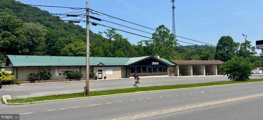 72-hour notice for all showings! This 4-unit commercial building is currently fully occupied, producing great income. Situated along highly traveled National Hwy in Lavale sitting on a 1.2 ac. (+-) site. Property contains lots of paved parking for businesses. Financials are available to qualified buyers. Call office for more details.