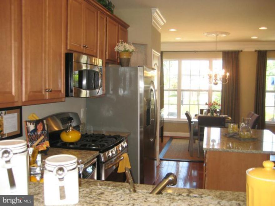 Fully Loaded .Avail July 1. Former Model Home, This town home has it all , garage, open floor plan, 1600+sqft ; Hardwood floors entire main level .Eat-in-Kitchen; SS appliances, Granite Counter top and Trek Deck....and much more.  Facing the pool.....plenty of parking around.....$45 processing fee per applicant, call LA for any questions. Pictures are for reference only, to be rented unfurnished.