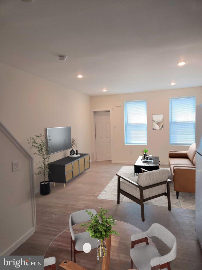 Investor special! This stunning 2-story home, nestled in the coveted Point Breeze neighborhood, has been meticulously renovated to offer modern comfort and convenience. Enter into a bright, open living and dining area that flows seamlessly into a well-appointed kitchen featuring stainless steel appliances, Corian countertops, and a convenient powder room with laundry. Step outside to a private rear yard with a brand-new deck, perfect for outdoor relaxation. The unfinished basement, with its high ceilings and updated mechanicals (Carrier HVAC, electric water heater, 100-amp service), provides ample storage. Upstairs, you'll find two bedrooms with new carpeting, including a main bedroom with a spacious closet, and a beautifully tiled bathroom with double sinks. Enjoy the convenience of a Walk Score of 78 and a Bike Score of 86, with the Broad Street Line just a minute's walk away. Nearby parks enhance the neighborhood's appeal. Don't miss this opportunity. Schedule your private showing today!