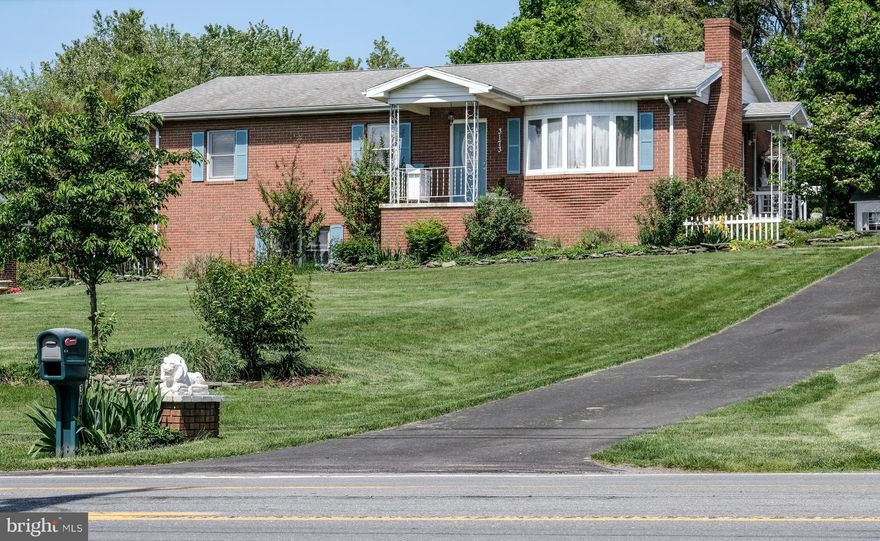 All you have to do in this tastefully decorated brick rancher is bring your furniture.  Some of the features you will encounter in your new home are gleaming hardwood floors throughout, 2 wood burning fireplaces, 3 bedrooms all with ceiling fans, bright and cheery kitchen and dining area.  The covered patio and detached deck create a pleasant setting where you can entertain friends or simply savor the outdoors.  The living room is warm and cozy with a wood burning fireplace, hardwood floors, built in shelves and a bow window for natural light.  The unfinished basement with a wood burning fireplace and plenty of light affords you the opportunity to finish to suit your needs.  Parking is not an issue with the oversized two car detached garage and extended driveway.  The shabby chic SHE SHED in the backyard offers ample space and versatility for various hobbies, projects or is perfect for your personal getaway.  The beautifully landscaped yard situated on .75 acre creates a parklike setting. This house is a must see! Convenient location close to VA Hospital, IRS and Coast Guard.