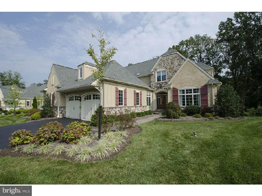 Spectacular Treymore model carriage home on premium lot in coveted Haverford Reserve. This light filled home features: grand foyer entrance, wide plank hardwood flrs, generous millwork, 9ft ceilings, upgraded lighting. Gourmet Kitchen w/spacious center island, breakfast rm, (Wolf & Viking) appliances, granite countertops, beautifully custom crafted cabinets & custom trim. Formal Living rm w/stone FP, formal Dining Rm w/flr to ceiling windows, inviting Library/Study, European Style Powder rm,& Laundry Rm. Oversized deck overlooking beautiful woodlands. Luxurious 1st flr Master BR Suite w/sitting area. Spa inspired Master marble BA w/walk-in shower & Jacuzzi, custom vanities, Caesar stone countertops & walk-in closets. 2nd flr features 2 generous BRs, 2 Full BAs & Den that could be used as an additional BR. W/O Lower Level features oversized BR w/Full BA & Sitting Area. Exquisitely appointed Rec Rm w/marble FP & entertainment bar,& Workout Rm. Haverford Reserve is situated on 124 acres of breathtaking woodlands