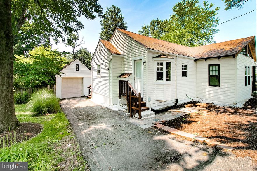 PRICED TO SELL****A Masterfully Reimagined Retreat in Tremont Gardens!  
Dazzling from the moment you arrive, glide through the magnificent grand foyer, where sunlight dances through a custom wood-arched transom and grand transom window -- setting the tone of unique artistry for this home.
Nestled on a whisper-quiet street, this 3-bed, 3-bath sanctuary unfolds across 1,490 sq ft of entirely reimagined living space, radiating style at every turn. Freshly rebuilt, it’s a rare gem where no detail was spared!  
The heart of the home pulses in the gourmet kitchen, a chef’s playground boasting sleek stainless steel appliances, crisp 42' white cabinetry, and granite countertops. Unwind in the open living and dining area, warmed by a radiating fireplace beneath several new ceiling fans with light -- while brand-new luxury flooring flows underfoot along with refreshed hard wood on entire main level. Two main-level bedrooms include one with ensuite bath oasis, and second bedroom with serene deck sliding-glass access over looking the tree lined backyard. Downstairs, discover a sprawling lower-level bedroom, a versatile craft/workout space, and a full bath... all anchored by a walk-out basement that blurs indoor-outdoor living.  
Outdoor Euphoria: Step outside to your 0.30-acre Eden—a lush, fenced paradise where future gardens bloom and a stone-accented reflecting pond invite lazy afternoons. Sip lemonade, or fire up the grill for summer soirées under string lights of privacy. With space for gardening, play, or pure Zen, this backyard is your private escape. Park cars with ease in the detached 1-car oversized garage or along a new concrete wide strip providing a second separate driveway opposite the garage side of home. Revel in zero HOA fees. Life in Tremont Gardens: Top-tier Fairfax County schools, leafy parks, and buzzing farmer’s markets are just steps away. Hop onto major commuter routes effortlessly, or unwind in the blend of suburban calm where contemporary elegance meets cozy charm.***MAIN WATER LINE HAS BEEN REPLACED FROM THE STREET TO THE HOUSE. BASEMENT HAS BEEN COMPLETELY WATERPROOFED. NEW HOT WATER HEATER. NEW SUMP PUMP.