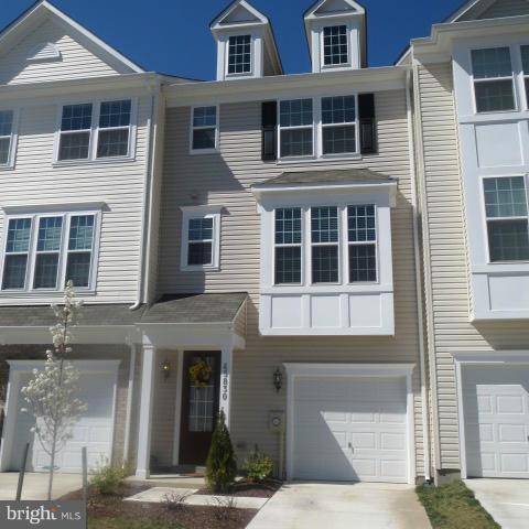 Beautiful townhome in sought after community and filled with lots of natural light. Nicely upgraded with hardwood floors, granite counters, ceramic tiled baths, dual sinks, spacious deck, one car garage and more. You will enjoy stress free living in this conveniently located home with many community amenities.