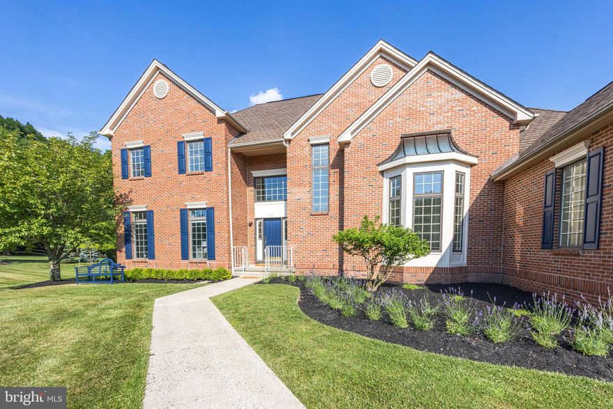 Stunning cul-de-sac home minutes from historic Newtown Boro featuring a spacious first floor primary bedroom suite and an in-law or aupair suite on the second floor. The spacious and level 1.22 acre lot backs up to woods that offers a feeling of seclusion. Enter this sunny customized home, filled with many desirable upgrades and improvements; such as the imported limestone foyer, the elegantly turned staircase, the detailed wood molding & the arched entryways into the formal dining room.  Over $10,000 of lighting from Restoration Hardware bring additional grace and elegance to the home.  Enjoy the upgraded gourmet kitchen complete with an oversized center island with gorgeous granite counters, custom cabinetry, Sub-Zero refrigerator and built-in Marvel wine cooler, then relax in the adjacent screened-in porch. Gather everyone in the Great Room with the 2-story vaulted ceiling, elegant gas fireplace and walls of windows. When it's time to retreat, step into the European-inspired first floor primary suite. The elegant bedroom has a charming cushioned window seat with built-in storage, loads of recessed lights & two large professionally organized walk-in closets. Unwind in the oversized, luxurious master bath featuring Grohe showerhead & side body sprays, jacuzzi whirlpool, 2 built-in laundry hampers. The gorgeous library or home office features an 11' ceiling, a spectacular oversize bay window and double-doors for privacy when needed. A well appointed laundry room & powder room complete the first floor. Upstairs are 3 large bedrooms outfitted with oversized & professionally customized  closets & recessed lighting, along with a well appointed full hall bathroom with a tub & large linen closet as well as the full bathroom in the in-law/aupair bedroom. Designer carpeting, hardwood floors, Pella conservation window system, upgraded wood moldings & trim, huge basement with wood flooring and two additional rooms for another office plus exercise room are features that can be yours. There is a 3 zone, 2 unit Carrier hybrid HVAC smart systems each with electronic air cleaners and humidifiers. Central Vacuum. At the driveway is a Tesla charger for an electric vehicle.
Don't miss out on this spectacular home!