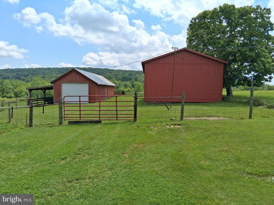Lovely rolling 6.51 acres of farm land with 18x27 barn with stalls. Newer 25x45 run-in/machine shed metal building and 18x30 garage attached to barn. 1/2 acre pond recently redone.  Within minutes of city amenities in a lovely rural community.  Owner will not perk. Sold "as is".