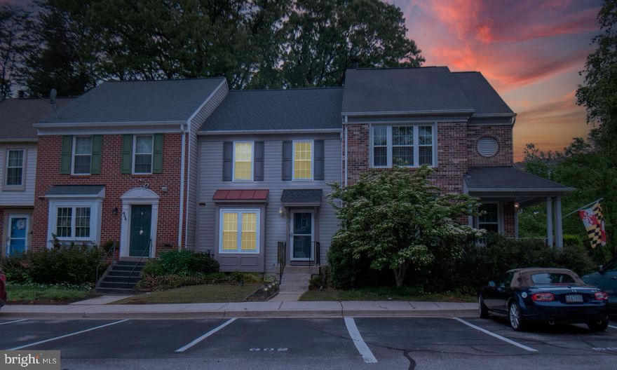Welcome home!  Discover this beautifully maintained townhouse, nestled in the Lions Gate Community. Step inside to find an eat-in kitchen featuring stainless steel appliances,  backsplash, and ample counterspace ideal for cooking. The cozy living room includes laminate wood flooring and a chic brick fireplace perfect for Maryland’s chilly nights, creating an inviting atmosphere for both relaxation and entertainment.  Upstairs, the primary bedroom is complete with an attached full bathroom for maximum privacy and convenience.  Accompanying the primary, there are two additional bedrooms and another full bathroom on the top level.  Venture downstairs to the basement where entertainment possibilities abound. This space is outfitted with a spacious family room, an appealing new wet bar with granite countertops, and a wine refrigerator.  A handy half bath adds to the comfort and functionality of this lower level.  New Roof (late 2024) and newer HVAC (2023).  This home is ready for you!