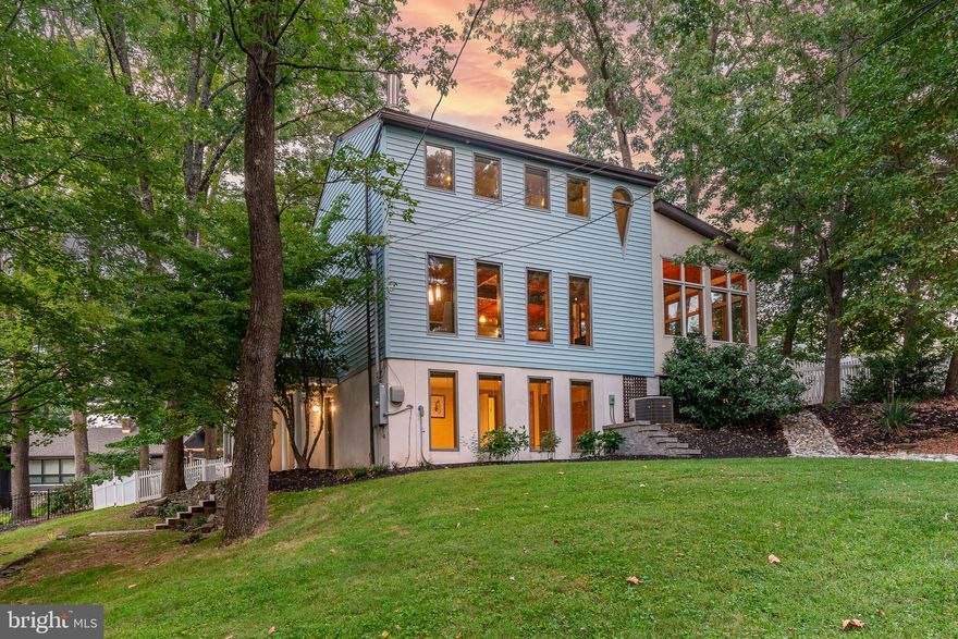On a beloved block that’s so close to so much, this custom-designed dwelling has been thoughtfully expanded to create an open-concept floor plan that will make your heart sing. Bumped out and expanded, a great room was created, forming a captivating space that blends the gourmet kitchen, dining, and living areas into one harmonious expanse. Towering red oak ceilings infuse the space with warmth, while a wall of windows allows natural light to flood in, highlighting the exquisite craftsmanship at every turn.  A modern gas stove in the great room invites you to relax.  Gorgeous hardwood flooring with 4 fireplaces creates much appreciated character and style. Chefs and entertainers alike will love the dream-come-true kitchen with stainless appliances, a center island, complete with seating for six, a work sink, a beverage fridge with ice maker, a stainless-steel farm sink, a 4-burner gas cooktop, grill and hood vent, a wall oven, convection oven/microwave, warming drawer, fridge, dishwasher and even a wine fridge.  With three bedrooms spread across different levels reached via custom rough-sawn staircases, this home offers an abundance of privacy. The spacious main bedroom, offers a cozy wood burning fireplace with outdoor deck access for those morning coffees in the fresh air, will surely indulge with an ensuite bathroom boasting an oversized rain shower, a sumptuous soaking tub, double commodes, and a bidet and double sinks. On the third floor, the generous second bedroom with its own en-suite bath, private sitting area and ample closet storage provide another private retreat having a gas fireplace for chilly nights.  The ground floor beckons you to unwind and relax in the spacious family room, complete with a crackling fireplace. This level also has a third bedroom, with a wall of windows and a built-in Murphy bed, that could also be used as a home office and adjacent full bath.  The fenced backyard oasis promises endless enjoyment throughout the seasons. Take a dip, relax or work out in the oversized swim spa and gather around the outdoor fire place as the evening sets in when not enjoying the vibrancy of New Hope’s nightlife.  A very special community and all just a short walk to the many award-winning restaurants, shops, The Bucks County Playhouse, The Delaware River and over the bridge into charming Lambertville.