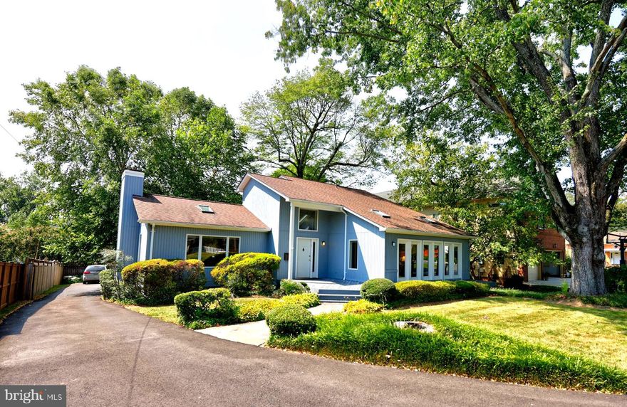 The most rare find, mutli-genrational home walking distance to downtown McLean is now for sale. Stunning living space on the main level with 2 story ceilings, hardwoods and a cozy fireplace. A completely separate apartment with private entrance on the lower level AND ANOTHER separate apartment above the 2 car, detached garage. Both apartments have full kitchens, a full bath, a private entrance and washer and dryer!!! Gorgeous wood sided facade greets you. Step inside to an incredibly open floor plan boasting soaring, cathedral ceilings .Wood flooring throughout and beautiful kitchen with granite all enhance the beauty of this home. A first-floor primary bedroom with an oversized dressing room, connects through to an oversized, private library. The library offers floor to ceiling windows across the entire front wall. The library with another full bath can also serve as a second primary suite on the main level.  The upper level with additional bedrooms and a bath is ideal for separate living space. The lower level boasts 10 foot ceilings! Oversized 2 garage and the most private lot even though you are walking distance to downtown McLean.