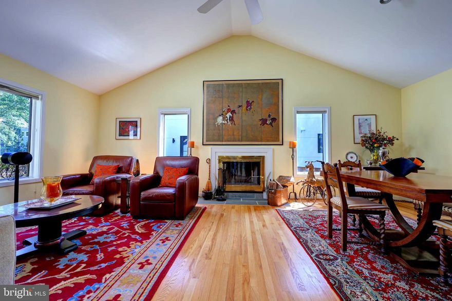 A RARE find... a mutli-genrational home in pristine condition is walking distance to downtown McLean. Stunning living space on the main level with 2 story ceilings, hardwood flooring and a wood burning fireplace as the focal point. A beautiful kitchen with granite countertops, cathedral ceilings and a breakfast bar is open to the main living space. You could also enjoy dining al-fresco on the screened-in porch off of the dining room. There are two primary suites, each with it's own full bath on the main level. One suite is currently being used as a huge, in-home office with a wall of floor to ceiling windows.  The second primary,  features a garden bath with soaking tub, double vanities and a huge, walk-in shower. You will also find an oversized walk-in dressing area, second walk-in closet and French doors with access to a private deck to unwind with fresh air before bedtime. OR, enjoy your morning coffee and newspaper here.  A completely separate apartment with private entrance on the lower level AND ANOTHER separate apartment above the 2 car, detached garage. The lower level family room boasts a soaring, 12 foot ceiling! There is a separate foyer into the LL apartment. Both apartments have full kitchens, a full bath, a private entrances and washer and dryer!!!  The apartment over the garage features a breathtaking skylight over the main living area. SO MUCH POTENTIAL HERE. Air BNB both , move-in Mom and Dad, your teen can have their own space, perfect for an au-pair! Don't miss this VERY rare opportunity.