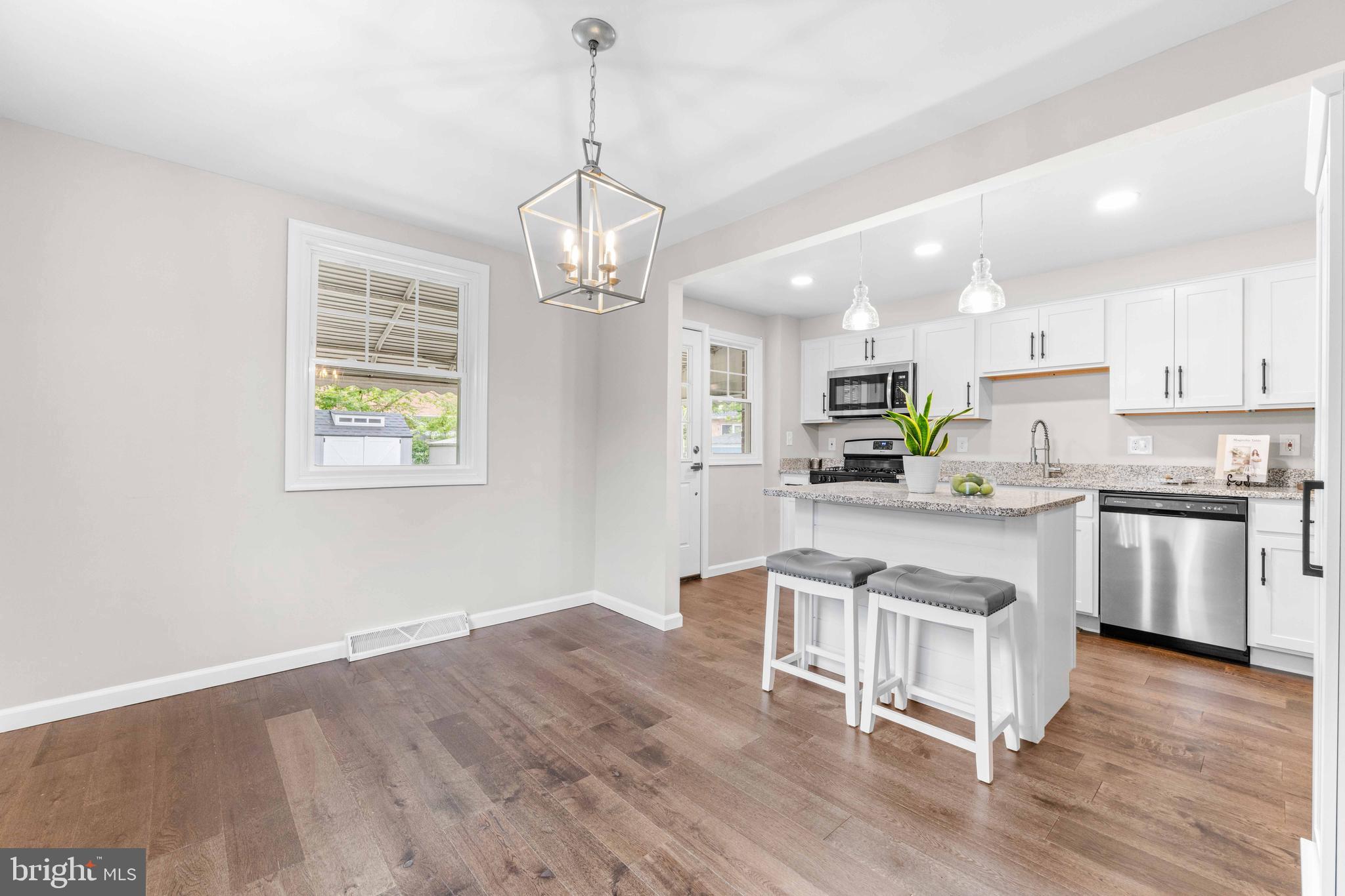 Multiple offers received - seller is reviewing offers and signing one this evening. *Open House Fri 5-7PM & Sat 4-6PM* Completely renovated duplex/townhome with NO HOA fee (more buying power!) a dreamy, level fenced yard with new patio, shed, and easy driveway or street parking! Within the last 3 years, this home underwent a total transformation, saving you tens of thousands: New kitchen, baths, luxury plank flooring throughout (no carpet), replacement windows, roof/gutters, gas furnace, AC, water heater, doors, drywall, paint, washer/dryer, lighting, insulation, and more! There is tons of closet space in the upstairs hallway, and a finished basement with rec room, full bath, and laundry area/storage. Only 5 minutes to the North Arundel Aquatic Center, 15 min to BWI, and 20 min. to Ft Meade - this quiet community close to it all is a total WIN!