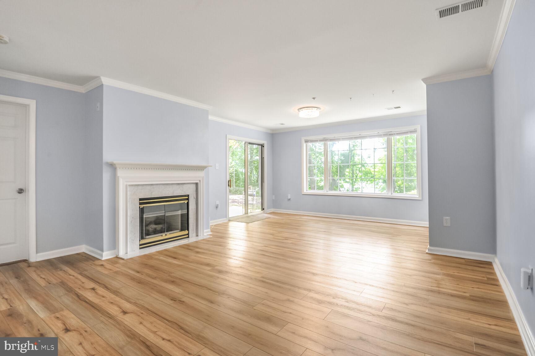 Welcome to this beautiful lower level condo in the sought-after Shore Harbour community—perfect for pet owners and nature lovers alike! Step right outside your back door onto the nearby trails without having to walk through building common areas -- ideal for daily walks and lakeside relaxation. It truly feels like your own private, lakefront backyard, and you can even access your back door via a short path from your private parking spot. And, fear not on storage space - the primary bedroom closet comes equipped with a custom Closet America system with a transferable lifetime warranty to organize every bag and shoe! This move-in-ready, 2 bedroom, 2 bath home also features recently replaced flooring and fixtures, a cozy gas fireplace for year-round comfort, a 4-year-old HVAC system for more energy-efficient climate control, a spacious chef's kitchen, and a private patio with tranquil lake views and storage. Imagine waking up in the primary bedroom and opening the sliding door a few steps away to watch the sun rise and set. Yes, please! And you'll move in just in time to enjoy the community's pool, clubhouse, and tennis and pickleball courts for the season. Located just a few paces from Little Seneca Lake and a bike ride away from the 2,000-acre Black Hill Regional Park. Minutes from shopping and dining, and one mile to I-270, this condo offers the perfect blend of comfort, convenience, and natural beauty. Please schedule all showings online via Showing Time.