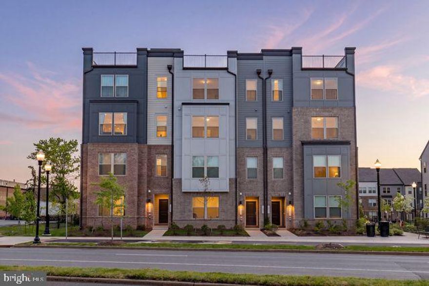 Welcome to Park Place in the heart of Herndon—where modern living meets unbeatable convenience. This spacious 2-level townhome-style condo offers 2,433 sq. ft. of stylish and functional living space, thoughtfully designed for both everyday comfort and effortless entertaining.

Featuring 3 bedrooms, 2 full baths, and 1 half bath, this beautiful home boasts an open-concept main level with 9 ft ceilings, a modern kitchen with huge quartz countertops, extended oversized island, stainless steel appliances, and a large walk-in pantry, seamlessly flowing into the living and dining areas. The main level also includes a dedicated office/study and a covered balcony, perfect for relaxing or working from home.

One of the home’s standout features is the huge rooftop patio, ideal for outdoor dining, entertaining, or simply unwinding. An additional covered outdoor space adds even more versatility.

Upstairs, the spacious primary suite offers a large walk-in closet and private bath, along with two additional bedrooms and a conveniently located laundry room. The ground level includes a 1-car garage plus driveway parking.

Residents enjoy exceptional community amenities including bike parking and repair stations, tot lots, exercise areas, pocket parks with seating, and walking trails connecting to the future Herndon trail system. Exterior and yard maintenance are included for truly low-maintenance living.

Ideally located within walking distance to H Mart, Lidl, Bank of America, Capital One, Truist, Planet Fitness, and a variety of popular restaurants including Chinese (Peter Chang & Hunan), Korean, and Indian dining options. Just 1.5 miles to the Innovation Metro Station (Silver Line), approximately 6 minutes to IAD / about 2 miles to Dulles International Airport, and close to the upcoming Rivana Town Center, Herndon Community Center, golf courses, tennis courts, and scenic trails.

A perfect blend of space, style, and location—this home truly offers the best of Herndon living.