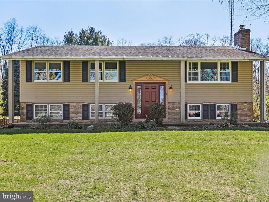 Nestled on over an acre of land, this beautifully renovated split foyer home offers modern comforts with a touch of rustic charm. Enjoy the privacy of country living with the convenience of included lawn care and snow removal. Step inside to find nearly the entire home outfitted with brand-new luxury vinyl plank flooring. The upper level features an inviting open floor plan, seamlessly connecting the living, dining and kitchen areas. The stylish kitchen boasts a granite island, brand-new shaker-style soft close cabinets, sleek black appliances, recessed lighting and a spacious pantry. Adjacent to the dining area, a bright sunroom offers a walk-out to the rear yard and a laundry space, which landlords are willing to relocate to the lower level if preferred. The upper level also includes a primary suite with it's own private bath, two additional bedrooms and a second full bath. The lower level is a Pinterest worthy retreat, featuring a stunning family room with board and batten wall treatments, charming barn doors and a striking floor to ceiling brick fireplace with a wood beam mantle and new electric fireplace insert. Some additional highlights include: an oversized two car garage with ample storage, a brand-new heat pump and replacement windows for energy efficiency and fresh paint, throughout.  This home is like new! Don't miss this opportunity to enjoy a beautifully updated home in a serene rural setting!  This is a no smoking and no pet property. The separate detached garage is not included with this rental. Landlords are looking for a credit score of 650 or higher and steady/stable employment.  All tenants 18 and older will be screened prior to any showings. Application fees are non-refundable. Room sizes and square footage are estimated.