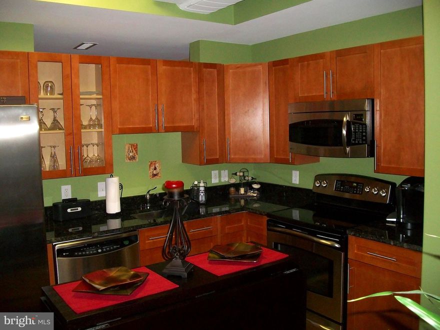 Welcome to this stunning one-bedroom condo with a versatile den/flex space located in the vibrant community of The National Harbor. This elegant residence offers the perfect blend of modern luxury and convenience, making it an ideal choice for those seeking a sophisticated urban lifestyle.

Key Features:

Spacious Living Area: The open-concept living space is bathed in natural light, providing a warm and inviting atmosphere for relaxation and entertainment.

Gourmet Kitchen: The kitchen boasts high-end stainless steel appliances, sleek granite countertops, and ample cabinet space, perfect for culinary enthusiasts.

Private Bedroom: The generously sized bedroom offers a peaceful retreat with large windows and a spacious closet.

Versatile Den: The den is perfect for a home office, guest room, or additional storage, adding flexibility to your living space.

Luxurious Bathroom: The modern bathroom features premium fixtures, a large vanity, and a relaxing tub/shower combo.

In-Unit Laundry: Enjoy the convenience of an in-unit washer and dryer.

Juliet Balconies: Step to either the Juliet balcony off the bedroom or the one off the living area and take in the stunning views of the National Harbor and beyond.

Amenities: Residents have access to a range of amenities, including a fitness center, rooftop pool, community lounge, and secure assigned parking.

Location:

Situated in the heart of National Harbor, this condo offers unparalleled access to a variety of shops, restaurants, and entertainment options. Enjoy waterfront dining, boutique shopping, and year-round events just steps from your door. With easy access to major highways and public transportation, commuting to Washington, D.C., and the surrounding areas is a breeze.

Experience the best of urban living with the charm and convenience of National Harbor. Don’t miss this opportunity to make this exquisite condo your new home!