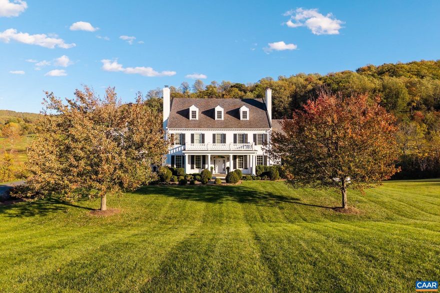 Located in the desirable Ragged Mountain neighborhood, this stately 6 bedroom residence blends timeless architecture with thoughtful, high-end updates. The home offers mountain and pastoral views and an ideal mix of elegance, comfort, and convenience?just minutes from Charlottesville. A gracious columned porch opens to light-filled interiors enhanced with designer lighting, custom wallpaper, window treatments, and freshly refinished spaces throughout. The main level features formal living and dining rooms, a paneled library, and a spacious family room anchored by a marble-surround fireplace. The gourmet kitchen includes premium appliances, stylish pendant lights, and a large island perfect for entertaining. A primary suite on the main level offers the ease of first-floor living, while a second primary suite upstairs enjoys mountain views and a spa-like bath. Additional bedrooms, a second-floor laundry, and a third-floor bonus space?ideal for a playroom, recreation area, or studio?complete the upper levels. The lower level offers a full floor of recreation with a movie theater, gym, and new hot tub. Exterior highlights include a freshly stained deck, repaved driveway, and updated lighting.,Granite Counter,Painted Cabinets,Fireplace in Dining Room,Fireplace in Family Room,Fireplace in Living Room,Fireplace in Master Bedroom