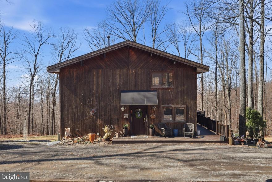 Escape the subdivision life for a residence defined by scale, privacy, and rugged utility. Set on 32.39+/- acres, this cabin-style estate is built for those who want their permanent home to feel like a fortress of solitude without sacrificing modern comforts. The interior features a recently updated kitchen equipped with new appliances and granite countertops. While there is a propane furnace, there is also a classic woodstove that provides a high-efficiency heating source and a focal point for the entertainment area in the basement. The home’s footprint is anchored by an expansive rear deck designed for four-season use; whether you’re hosting or decompressing, the integrated hot tub offers total privacy, screened by a dense canopy of mature timber to create an outdoor living room that feels completely removed from the outside world.

This isn't just a woodlot; it's a gateway. The property borders Gambrill State Park, providing exploration and recreational opportunities right out your back door. For the serious outdoorsman or the family seeking an active lifestyle, the land offers endless utility for hiking, scouting, and wildlife management. The long, wooded approach ensures a level of seclusion and security that is increasingly rare, making this an ideal primary residence for those seeking a quiet, secure environment.

Practicality meets potential inside and out, with a walkout basement that provides the ideal entertainment area or can be converted into a home office, gym, or additional bedrooms to grow with your needs. An existing shed provides organized storage for ATVs and maintenance equipment, keeping your primary living spaces clutter-free. Shown by appointment only, this is more than a getaway—it is a rare opportunity to own a significant piece of acreage with your ideal mountain retreat on your own recreational land in the Catocin Mountains.
