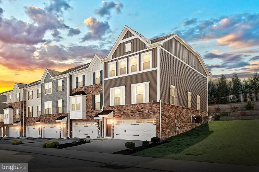 OFFER DEADLINE Thursday May 1 at 4:00 PM.
Welcome to easy living in the beautiful Regents Glen - Rosecroft Community!
This stunning end-of-row townhome offers a bright, open floor plan with thoughtful upgrades throughout. At the heart of the home is the centrally located gourmet kitchen, featuring granite countertops, 42” wall cabinets, an expansive island perfect for casual meals and conversation, stainless steel appliances, an elegant tile backsplash, and recessed lighting.  
This main level boasts a smart and flexible layout with two distinct seating areas—one at the front of the home and one at the rear—creating a natural flow around the open-concept kitchen. Whether you envision a dining area in the front or prefer the current setup with a second sitting area and a cozy family room in the back, each space adapts easily to your lifestyle. The rear living area opens to a stamped concrete patio through sliding glass doors, seamlessly blending indoor and outdoor living. With large windows on both sides and high ceilings, the entire floor feels airy, bright, and welcoming.
Step outside onto the patio to fire up the grill and enjoy the peaceful view of terraced landscaping and mature trees—no townhomes directly behind you, offering added privacy and tranquility. A bonus perk: overflow parking is conveniently located in front, just across from the home, perfect for visitors and providing a more open, scenic view from your front windows.
Upstairs, you’ll find three carpeted bedrooms, all with ceiling fans for added comfort. The primary suite is a true retreat, featuring a large walk-in closet with a stylish sliding barn door, and a spa-like en suite bath with a soaking tub, oversized shower, and dual vanities. A tiled laundry room with a deep utility sink adds extra function and convenience on the upper level.
The entry level includes a finished bonus room with a large window—perfect for a home office, gym, or media space. A rough-in for a full bathroom adds future flexibility, and direct access to the two-car garage makes everyday life a breeze.
All of this is nestled within the gated Regents Glen golf course community, where manicured grounds and premium amenities create a resort-like lifestyle. For even more enjoyment, the community’s golf course offers a separate pool membership.
Don’t miss your chance to own this gorgeous, move-in ready home in one of the area’s most sought-after neighborhoods!