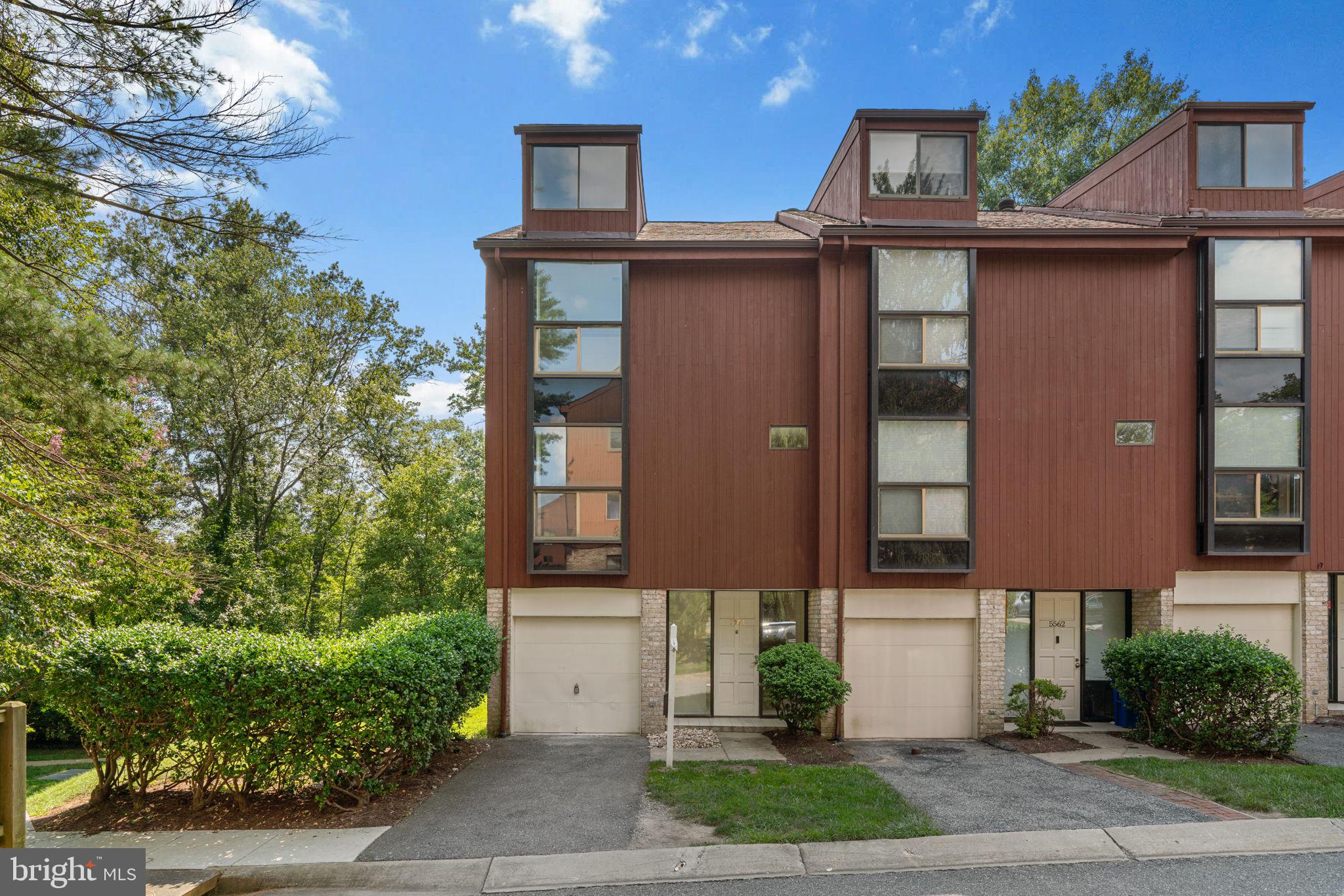 OFFER DEADLINE - The seller has requested all BEST & FINAL offers due by 3:00pm Friday, 8/22. This contemporary end-unit townhouse, in the desirable Glen Meadows community, offers four levels of stylish living, a glass atrium and a deck that opens to tranquil wooded views - all in an unbeatable Columbia location! Enjoy the convenience of a 1-car garage and low-maintenance living, with roof, siding, and yard care included in the condo fee.
Step inside to a welcoming entry-level family room featuring a cozy fireplace and sliders to a bright atrium, ideal for morning coffee or quiet afternoons with a good book. This level also includes a half bath and easy garage access.
Head upstairs to the main living space, where you’ll find a bright and spacious living room with a second fireplace and sliders to your private deck overlooking the woods. The kitchen includes bonus eat-in table space and windows on both sides providing abundant natural light. Another half bath adds convenience to this level.
On the third floor, you’ll find two oversized bedrooms and two full bathrooms, including the primary suite with vaulted ceiling, a skylight, and an ensuite bath featuring a soaking tub and separate shower. The laundry is also conveniently located on this level. The fourth level provides a versatile bonus space—perfect for a home office, art studio, guest room, or personal retreat.
Enjoy the best of Columbia living just steps from walking paths to Lake Kittamaqundi, Wilde Lake, the Merriweather District, Downtown Columbia, and the Mall. CPRA $1002.20 annual and condo fee $397 monthly
Property is being sold as-is and is subject to third-party approval but it is NOT a short sale. Seller will make no repairs.