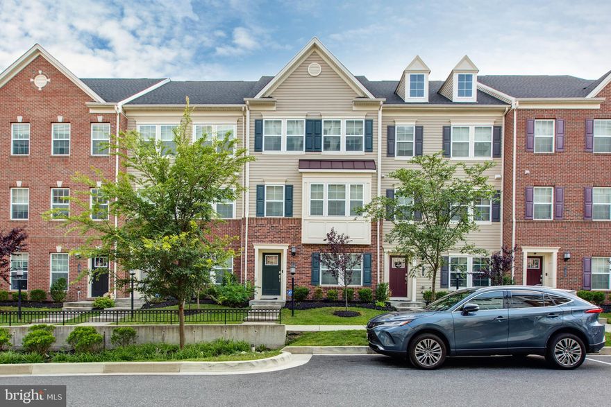 Welcome to 7465 Saint Margarets Blvd, located in the highly sought-after Oxford Square community!
This beautifully designed brick-front townhome with a 2-car garage offers four finished levels of stylish and functional living space. From the moment you enter, you'll notice the attention to detail—custom wall moldings, designer light fixtures, and elegant finishes throughout. The entry level features rear garage access, a full bathroom, and a custom built-in wall bench, perfect for a convenient drop zone. On the main level, enjoy a fully upgraded gourmet kitchen with a large center island, stunning custom trim work, and statement light fixtures that elevate the entire space. Upstairs, you'll find three spacious bedrooms and two full ba throoms, including a serene primary suite. The finished loft opens to a private rooftop balcony—ideal for a home office, entertaining guests, or simply unwinding in your own private retreat. Every corner of this home reflects designer taste and thoughtful upgrades that you’re sure to fall in love with. Located just minutes from major highways, Fort Meade, BWI Airport, and shopping centers, this home combines luxury and convenience in one perfect package.