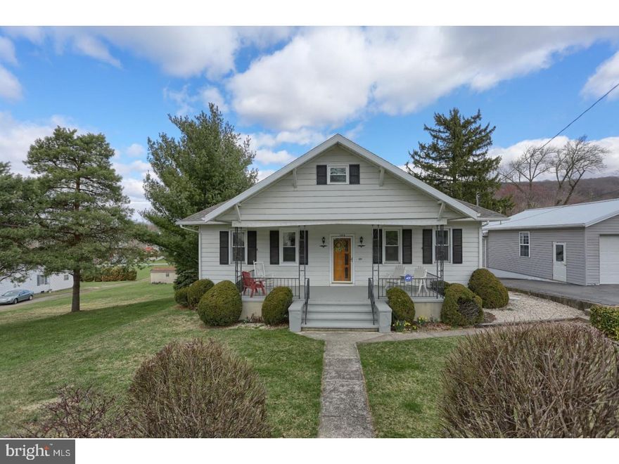 ALL THE "I WANTS" ARE HERE!  Step inside this 3-4 bedroom, 2 full bath home situated on over 1/2 acre in convenient location!  This home offers updated 37 handle eat in kitchen with stainless appliances, quartz countertops, soft close drawers, breakfast bar and engineered Bruce hickory hardwood flooring.  Large family room /sunroom which brings in tons of natural light, and leads to the nice size deck.  Spacious living room with fireplace and dining room, along with the master suite, with a full bath and a laundry chute, along with another bedroom and another full bath are located on this main floor level.  Upstairs you will find a 3rd bedroom, and a large attic area, which is in the process of being finished into additional living space, possibly a large 4th bedroom.  The basement is HUGE, with workshop space, a garage, a woodstove and lots of storage.  Outside you will find an oversized two car garage with more workshop space, which also has a woodstove and electric.    Enjoy outdoor entertaining in the large backyard, with patio and pavilion areas. The Pavilion has electric, ceiling fan, lights and outlets.   There all are new replacement windows, and 3 yr old Trane Heat pump.  Oh and did I mention that the home is well insulated?  The owner had insulation added to the exterior walls as well as between the floors, so this home stays nice and cozy.  1 year home warranty being offered with acceptable agreement of sale.  Come check it out!  It shouldn't last long!