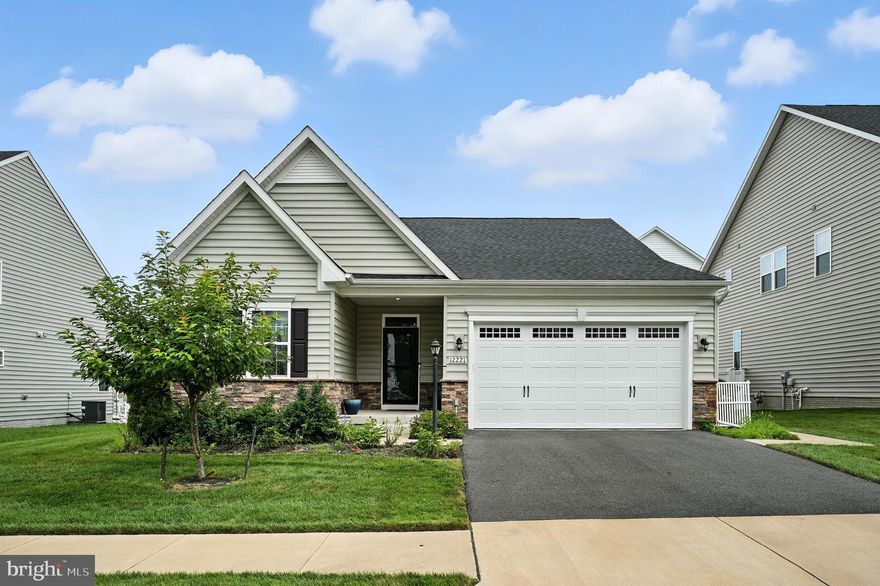 Welcome to this beautifully maintained home, built in 2020 and offering like-new condition throughout. Step inside to a welcoming foyer that opens into a spacious, open-concept layout with elegant crown molding and abundant natural light. Enjoy easy main-level living, with all bedrooms and living areas thoughtfully designed for comfort and convenience.

The upgraded kitchen features stainless steel appliances, a practical layout, and plenty of cabinet space—ideal for everyday cooking and casual gatherings. A cozy gas fireplace anchors the living area, creating a warm, inviting space for relaxing or entertaining.

The primary suite includes a vaulted ceiling, walk-in closet, and private en suite bath. The finished basement adds a full bedroom, full bath, and flexible living space—perfect for guests, a home office, or media room—plus a large unfinished utility room with ample storage.

Step outside to enjoy the screened-in porch, stone patio, and fully fenced backyard with a classic white picket fence. Located just off Prince William Parkway, this home is minutes from parks, a golf course, shopping, and other local amenities—offering the perfect blend of comfort and convenience.