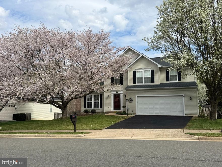 Nestled in a premier location that seamlessly blends convenience with sophistication, this exceptional residence offers the best of all worlds—easy access to premier shopping, dining, vibrant entertainment, and effortless commuting. Whether you're heading to the office, out for a gourmet dinner, or enjoying a day of retail therapy, everything you desire is just moments away.

Set on a beautifully flat, fully fenced lot, this home is a rare find—thoughtfully designed and impeccably maintained. Step inside to discover gleaming hardwood floors, classic architectural detailing, and a layout that exudes warmth and sophistication. The formal living and dining rooms are ideal for entertaining, while the heart of the home stuns with stainless steel appliances, a massive breakfast bar with seating for the whole family, and a sun-drenched breakfast area framed by a charming bay window and French doors that lead out to the deck for seamless indoor-outdoor living.

The extended family room is a showstopper, anchored by a gas fireplace and designed to accommodate both quiet evenings and lively gatherings. Its generous proportions and open sightlines elevate the everyday to the extraordinary.

Upstairs, retreat to a primary suite that feels like your own private oasis. This expansive sanctuary offers ample space for sitting, plus includes a spa-inspired ensuite bathroom featuring a soaking tub, walk-in shower, and dual vanities—pure luxury at every turn. Three additional secondary bedrooms and a beautifully appointed full bath complete the upper level with comfort and style.

The finished walk-out lower level is an entertainer's dream, boasting a sprawling recreation room, full bath, and access to the covered patio and flat, fenced yard. Whether it's game night, movie marathons, or backyard barbecues, this space was made for memories.

This home is truly a rare gem—stylish, spacious, and superbly located. A real treat for those who expect more from where they live.