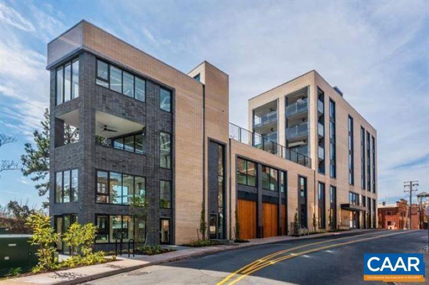 Located just one block from Charlottesville?s Historic Downtown Mall, The 550�represents the pinnacle of boutique, luxury living. Designed by Formwork and constructed by Martin Horn, this award-winning glass and brick landmark was recognized by the Urban Land Institute as the Most Influential Residential Construction Project of 2018. It is the only residence in the building with its own private entrance off Water Street. This striking three bedroom, three bath home features architect-designed details through out, including a stunning custom staircase, expansive windows and an open-concept living space that seamlessly blends style and function. Enjoy both a private covered terrace and an expansive rooftop deck with panoramic downtown and mountain views. The full-floor primary suite offers exceptional privacy and comfort, while two additional bedrooms provide flexibility for guests or a home office. Additional highlights include secure garage parking for two vehicles and the ease of low-maintenance, lock-and-leave living all in one of Charlottesville?s most desirable downtown locations.,Solid Surface Counter,Wood Cabinets