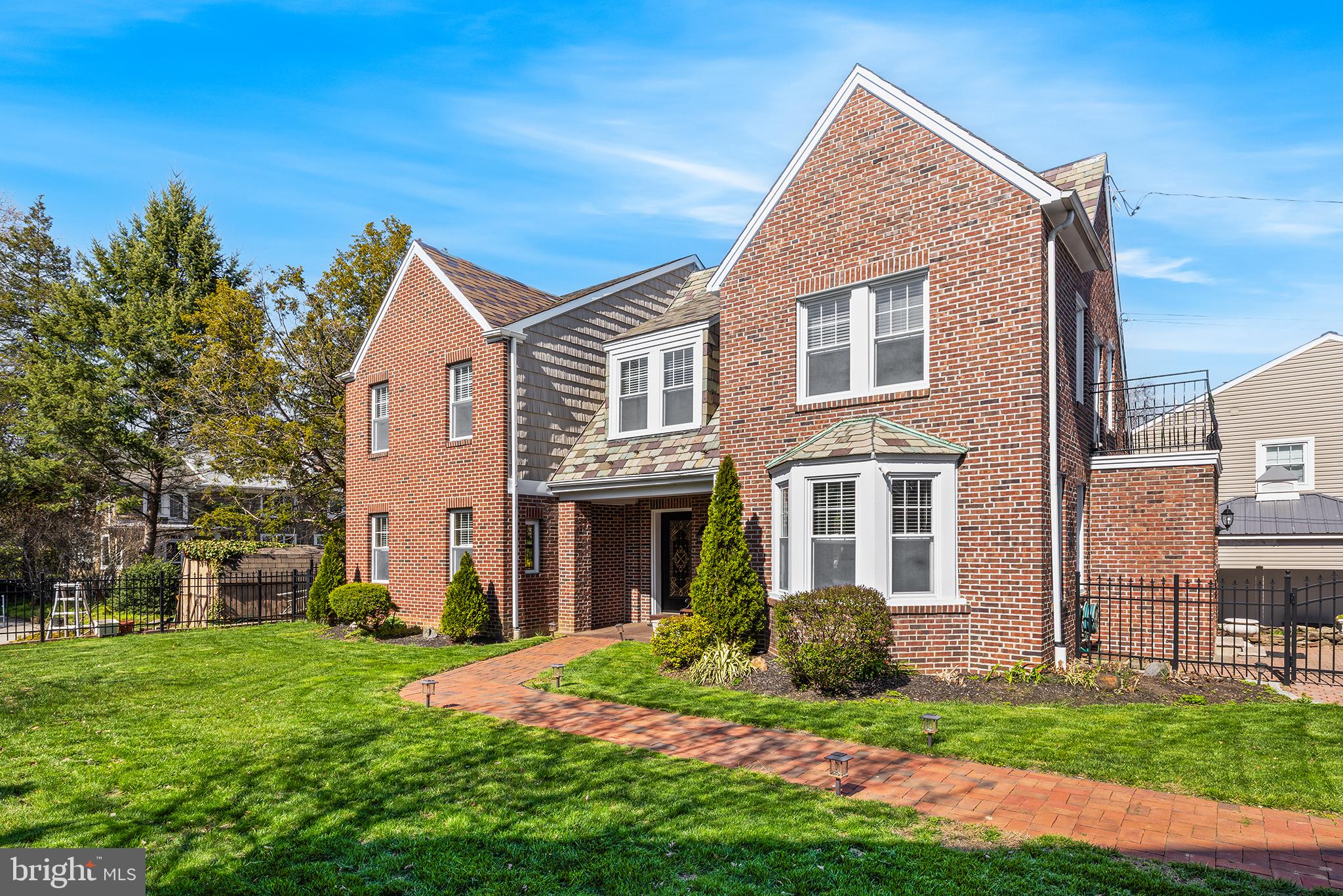 Charming 4 BD, 2.5 BA expanded carriage house with a detached three car garage, on a private lot, in picturesque Wissahickon. From the moment you drive up, the attention to detail is obvious from the newly paved oversized driveway, professional landscaping and brick paver walkways to perfectly placed fountains and lighting. Slate roof, brick exterior and vinyl shake siding as well as the wrought iron fencing only add to the curb appeal of this home. The formal foyer sets the tone with crown molding, recessed lighting and marble surround gas burning fireplace. Crown molding and recessed lighting continue into the large living room with ample natural light from recently upgraded dual pane vinyl windows which can be found throughout this home. Off the living room is a spacious dining room for everyday use and special occasions alike. The large eat-in kitchen features ceiling height cabinetry, granite countertops, gas cooking and stainless steel appliances and a cozy window seat with built-in storage. Convenient to the kitchen is a pantry for additional storage needs as well as a powder room. Upstairs the primary bedroom has a large walk-in closet and a private balcony and shares a hall bathroom with a secondary bedroom perfect for a home office or nursery. Two more spacious bedrooms connected by a large jack and jill bathroom with separate soaking tub and tile shower as well as laundry round off this level. The clean and well maintained unfinished basement provides ample storage with built-in floor to ceiling shelving and access to a utility sink. Outdoor retreat is a must see to truly appreciate this well planned area including extensive hardscaping with multiple patios, a koi pond, open grass areas, a covered pergola with a tv as well as a swim spa and outdoor shower. The three car detached garage is a unique feature to this area and includes a car lift and an air compressor with access to each of the three bays. This property truly has it all, including easy access to the hiking and biking trails of Fairmount Park and the Wissahickon, dining and shopping options near Manayunk, public transportation and major highways allowing for an easy commute both to and from the city.