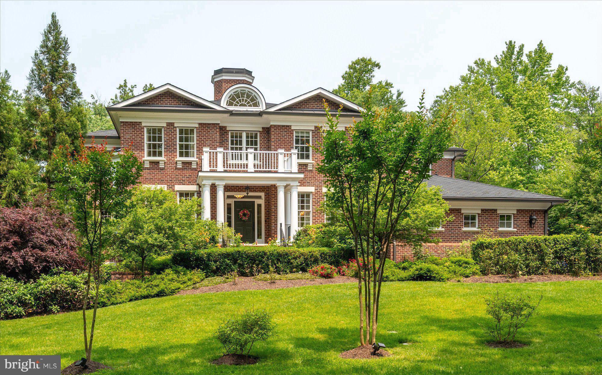 Welcome to 6804 Benjamin Street, a stunning custom-built estate nestled in the heart of Langley Forest, one of McLean’s most prestigious and sought-after neighborhoods. With gracious architecture, luxurious finishes, and an expansive open floor plan, this magnificent home defines sophisticated living.
Sited on an enormous, flat, and private lot, the residence offers approximately 10,000 sq. ft. of thoughtfully designed living space, including 6 spacious bedrooms, 6 full bathrooms, and 3 half baths. With 10-foot ceilings, designer lighting, hardwood floors, and custom made built-ins, the interiors radiate both warmth and refined elegance.
The main level is perfectly tailored for everyday living and grand entertaining. You are welcomed by a bright entrance foyer with cathedral ceilings, a graceful staircase, and a soaring chandelier that sets a stunning tone. This level features a formal living room and a private office with custom made built-ins, which share a two-sided fireplace. There is also an elegant formal dining room with a butler’s pantry and gorgeous lighting, as well as a charming piano/music room.
At the heart of the home is the gourmet kitchen, featuring a large walk-in pantry, an informal dining area, and an open great family room with fireplace and custom built-ins, perfect for family gatherings and entertaining. A dual staircase and a side entrance allow easy access for deliveries and informal visits. Additional main-level highlights include a built-in mudroom and access to the three-car garage, which provides ample parking and storage. A space for a future elevator offers convenience and long-term accessibility.
The primary suite is a true private sanctuary, featuring a coffee/wet bar and an oversized walk-in closets with custom built-ins. The spa-inspired bathroom includes a steam shower, heated floors, and a soaking tub. Each additional bedroom is generously sized and thoughtfully designed with en suite baths and walk-in closets, built-ins, ensuring comfort and privacy.
The fully finished walkout lower level is ideal for entertainment and extended living, with two additional bedroom suites and ample guest accommodations. There’s also space for a home theater, gym, wine cellar, and an expansive recreation area—perfect for entertaining or relaxing.
Outdoors, the professionally landscaped grounds provide a peaceful and picturesque retreat. The garden features 60 David Austin English rose bushes, as well as beautiful hydrangeas, clematis, and peonies, offering vibrant seasonal color and fragrance. A pergola with an outdoor fireplace creates a cozy setting for al fresco dining and entertaining. Multiple patios, a lush lawn, and room for a full-size pool complete this outdoor oasis.
Located just minutes from downtown McLean, Tysons Corner, top-rated schools, and major commuter routes, this exceptional estate offers a rare combination of privacy, luxury, and convenience.