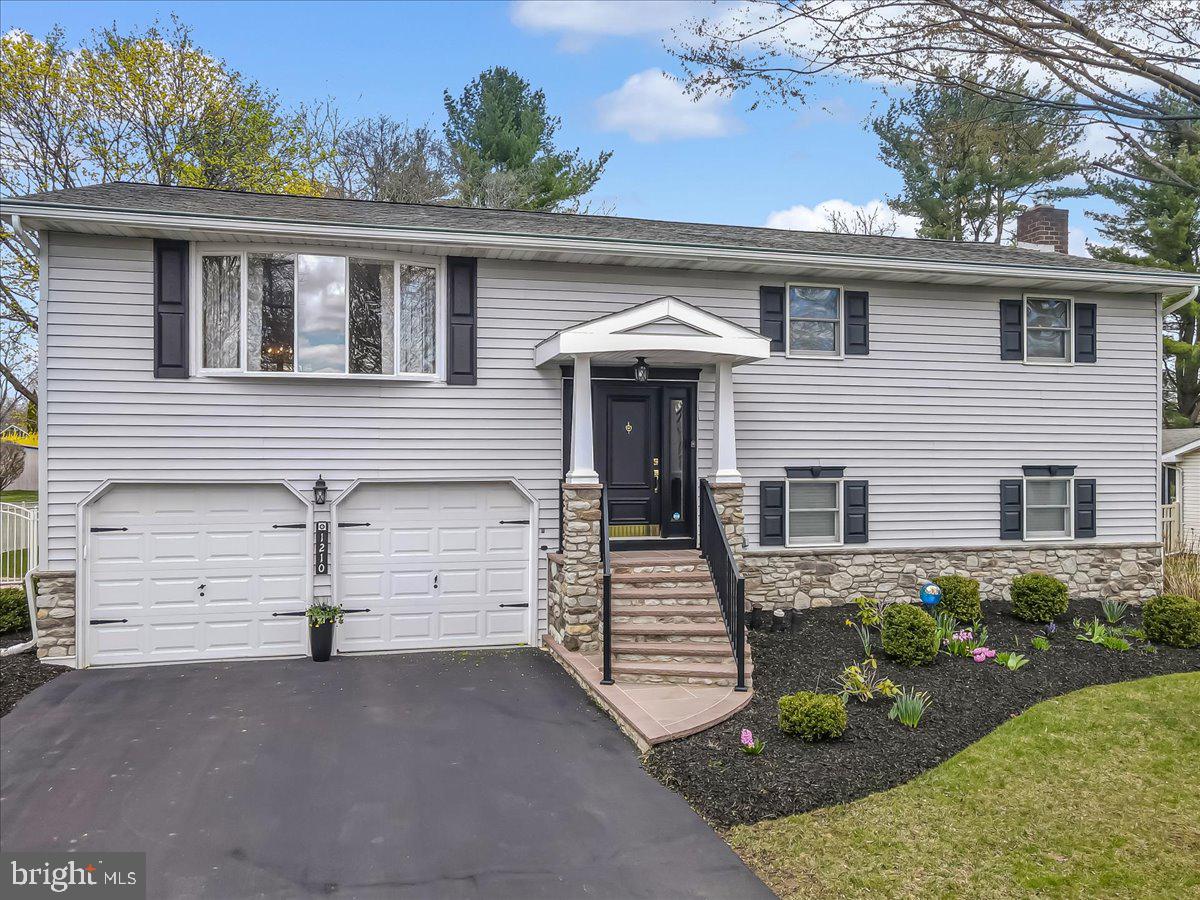 ***HUGE PRICE IMPROVEMENT***Welcome to 1210 Bluestone Drive — a spacious and inviting bi-level home tucked away in desirable Hanover Township, Bethlehem! With nearly 3,000 square feet of living space, this home offers a perfect blend of modern updates and original character, ready for its next chapter. Step inside to discover Brazilian cherry hardwood floors flowing through the kitchen and sunny breakfast nook, complemented by sleek stainless steel appliances. The main level features a fully updated hall bath and a gorgeous, completely remodeled primary bath — offering a little luxury every day. Downstairs, you’ll love the cozy family room, a bonus shower in the laundry area, and a versatile flex space just off the oversized 2-car garage — perfect for a man cave, craft space, game room, or whatever fits your lifestyle. Step out to the 3-season screened-in porch overlooking the flat, fenced-in yard — ideal for relaxing or entertaining all year long. Major updates provide peace of mind, including newer HVAC, hot water heater, and central AC. Plus — a clear certificate of occupancy means you can move right in with confidence! This is the kind of home where memories are made — filled with character, modern comforts, and room to make it truly your own. Don’t miss your chance to tour this charming Hanover Township home — schedule your private showing today!