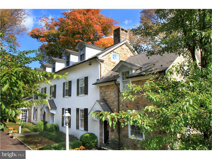 A gracious country estate in Buckingham Twp. Hidden down a rural lane yet just minutes to downtown, this private property is a once in a lifetime find. A fully restored manor-style stone home offers 5 bedrooms, a gourmet kitchen with dining area overlooking tastefully landscaped stone terraces and pool; a sun-filled family room, elegantly appointed dining room and formal living room. A stately great room features an over-sized stone fireplace, handsome exposed beams in a vaulted ceiling with a wet bar and attached timber-frame sun room. The master suite boasts one of seven total fireplaces, a private deck, attached study, walk-in wardrobe and en suite bathroom. This home was meticulously renovated to preserve its history yet thoughtfully updated for modern living. Picturesque grounds are both wooded and open pasture with perennial flower beds and bushes throughout. A large two-story barn, a charming one bedroom carriage house, stone-walled pond and the surrounding forest complete this spectacular property. A private, peaceful estate available for the first time in 30 years. An opportunity not to be passed by.