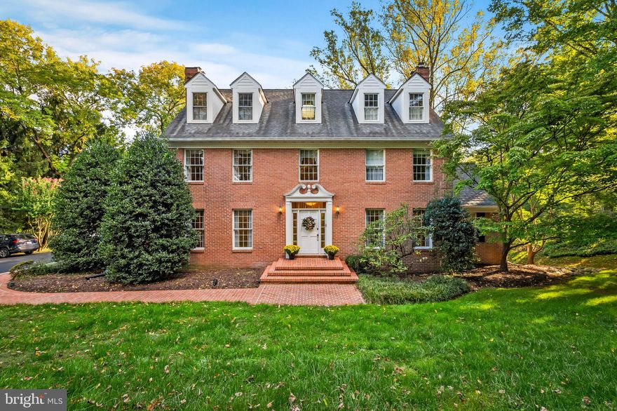 OPEN TODAY! Incredibly spacious and impeccably maintained center hall brick colonial is sited on a nearly 1-acre lot in the ideally located community of Ruxton, with easy access to Towson, I-83, and the Baltimore Beltway. Travel down the long driveway with parking for 4 cars to discover a professionally landscaped lot surrounded by beautiful evergreen trees that create privacy from neighboring properties.

With 5 bedrooms and 4 ½ baths, this home features nearly 4,500 square feet of living space on 4 levels. Enter through the gracious entry foyer flanked by the living room and dining room with beautiful hardwood floors. The circular flow on this main level offers numerous additional gathering spaces, including a library with a wall of built in shelving, sunny breakfast room, and family room - all with hardwood floors and each with a wood-burning fireplace or stove. The sizable kitchen with endless cabinetry, a large center island with a 6-burner cooktop, and double wall ovens enjoys a view of the sunny back yard. The adjacent family room provides access via French doors to a brick patio and expansive deck leading to the secluded rear and side yards.

A convenient side entrance leads to a powder room, mudroom/laundry room, and large 2-car garage.

Upstairs, you’ll discover the primary bedroom with an en suite bathroom, large walk-in closet, two additional bedrooms, and a full bath. The top floor features two more bedrooms and another full bath, plus a large landing area with a sunny skylight - perfect for a study nook.

In addition to above-grade living, the lower level features finished and unfinished recreational spaces. The highlight is a large recreation room with a wood-burning stove, home office space with custom built-ins, and double doors leading out to the beautiful rear yard.

Long-time owners have made many significant improvements to the systems, mechanicals, and structure, including a new heat pump/AC (May 2024) and another servicing the upper floors in 2019. Exterior improvements include a large project by Fick Brothers in 2012 that included roof and skylight replacements, AZAK dormers/siding, copper flashing, replaced gutters, chimney crowns and caps, as well as masonry work on sidewalks and patios.