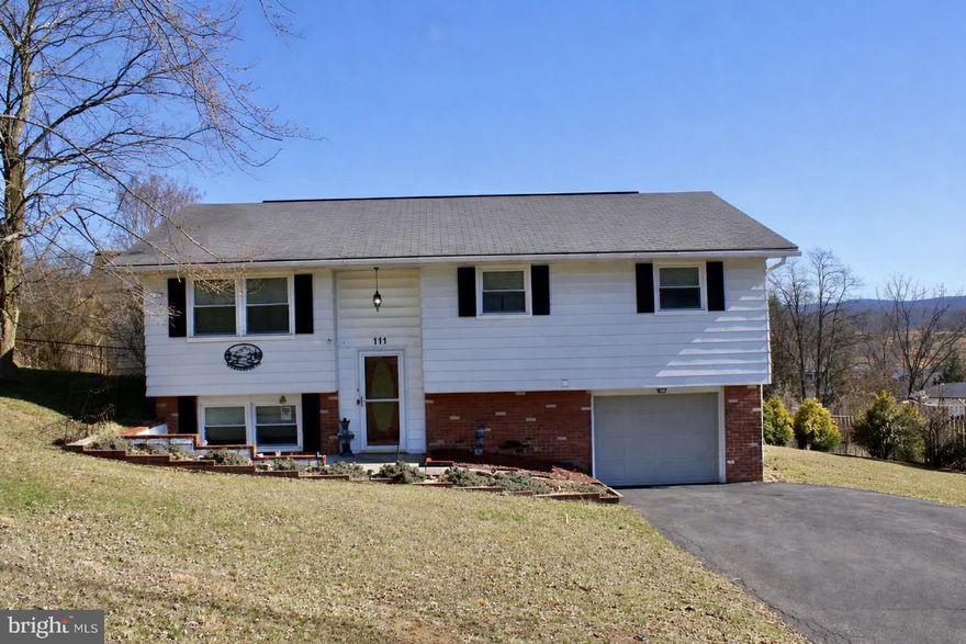 LOCATED IN POPULAR WEST SIDE ON A LOW TRAFFIC  STREET - THIS NICE SPLIT LEVEL FEATURES A LARGE LOWER LEVEL FAMILY ROOM - FORMAL DINING ROOM - NICE KITCHEN APPLIANCES - CENTRAL AIR - A BONUS ENCLOSED P ORCH OPENING TO A HUGE NEWER DECK WITH BEAUTIFUL MOUNTAIN VIEWS - ONE BEDROOM CURRENTLY USED AS A LAUNDRY AREA BUT CAN BE MOVED EASILY BACK TO BASEMENT AREA - 2 1/2 BATHS - NICE FENCED REAR YARD - AGAIN NICE MOUNTAIN VIEWS - DON'T MISS OUT ON THIS NICE HOME - SELLER NEEDS  TO FIND A SUITABLE APARTMENT - SMALL WORKSHOP AREA - STORAGE SHED