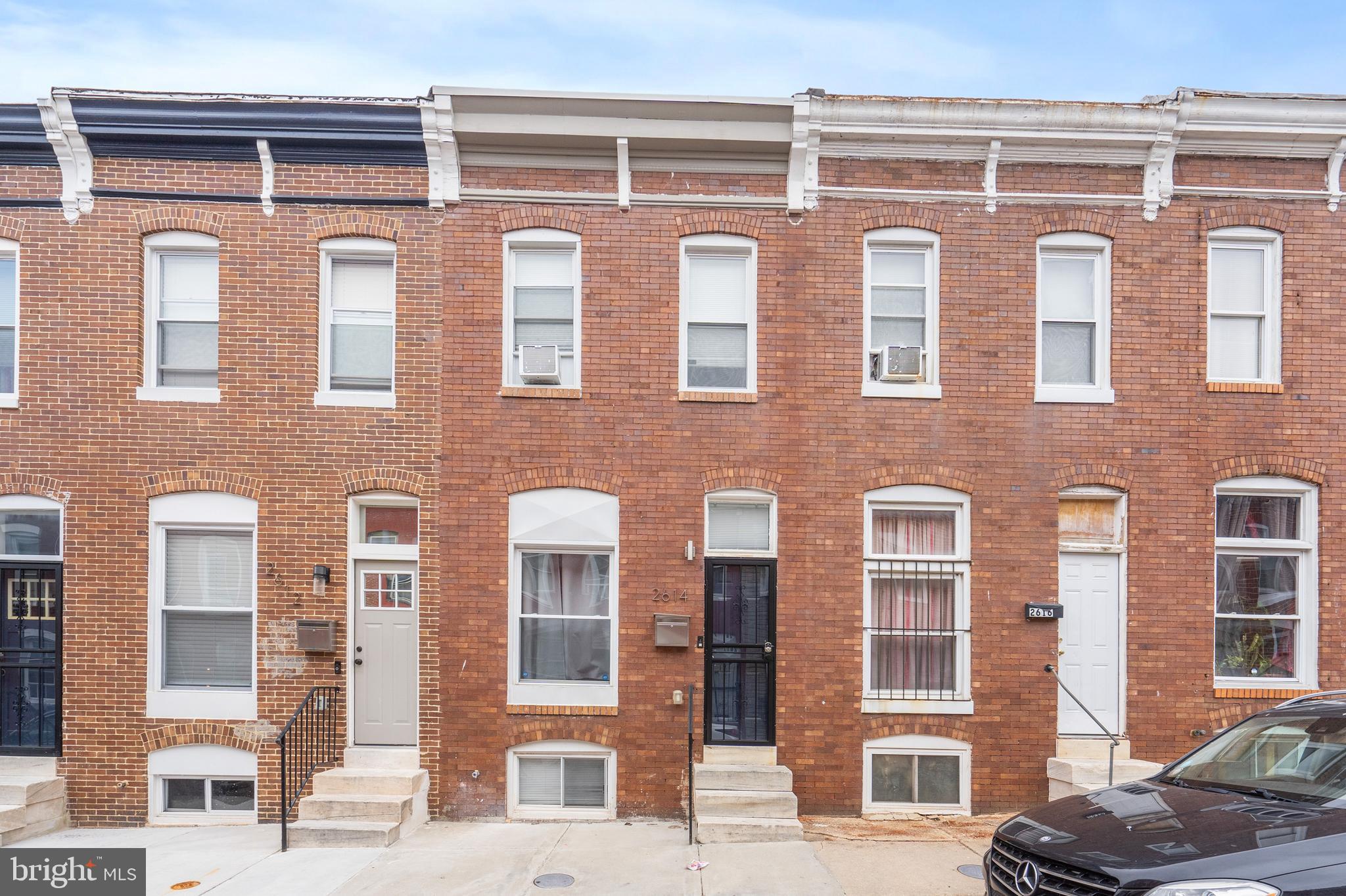 Take advantage of $0 down payment home loan options and make homeownership more accessible than ever! Welcome to this beautifully updated brick-front rowhome, offering a perfect blend of modern finishes and classic charm. As you step inside, you're greeted by hardwood floors that flow throughout the open-concept living and dining areas. The spacious kitchen features tray ceilings, quartz countertops, stainless steel appliances, and a custom tile backsplash. An island provides additional prep space and seating for quick meals, while ample cabinetry ensures plenty of storage. The bright and airy primary bedroom boasts hardwood floors, a large closet, and an ensuite bathroom with a custom tile walk-in shower. A second bedroom and a full bathroom with a tub/shower combo offer comfortable accommodations for guests. The convenient upper-level laundry room adds to the home's functionality. The fully finished lower level features a spacious bedroom, providing additional living space or a private retreat. Step outside to the fully fenced back patio, perfect for entertaining guests and hosting summer BBQs. Located near Clifton Park, Johns Hopkins Hospital, Route 40, and the Inner Harbor, this home offers easy access to parks, medical facilities, and city amenities. Don’t miss this fantastic opportunity—schedule your showing today!