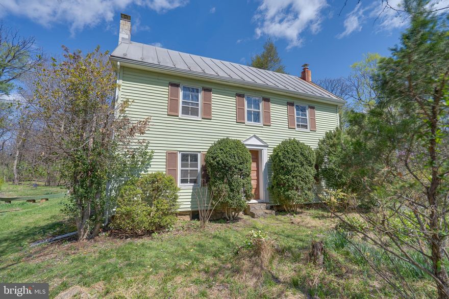 Charming 2-bedroom, 1-bath farmhouse in historic Shepherdstown! This affordable two-story home features exposed log beams, wood floors (including wide plank), built-in shelves, and a covered slate rear porch. Enjoy the peaceful wooded .47-acre lot with beautiful redbuds, bluebells and other plants creating a tranquil garden setting to be enjoyed from the a rear porch and patio. What a perfect blend of rustic character and modern convenience!