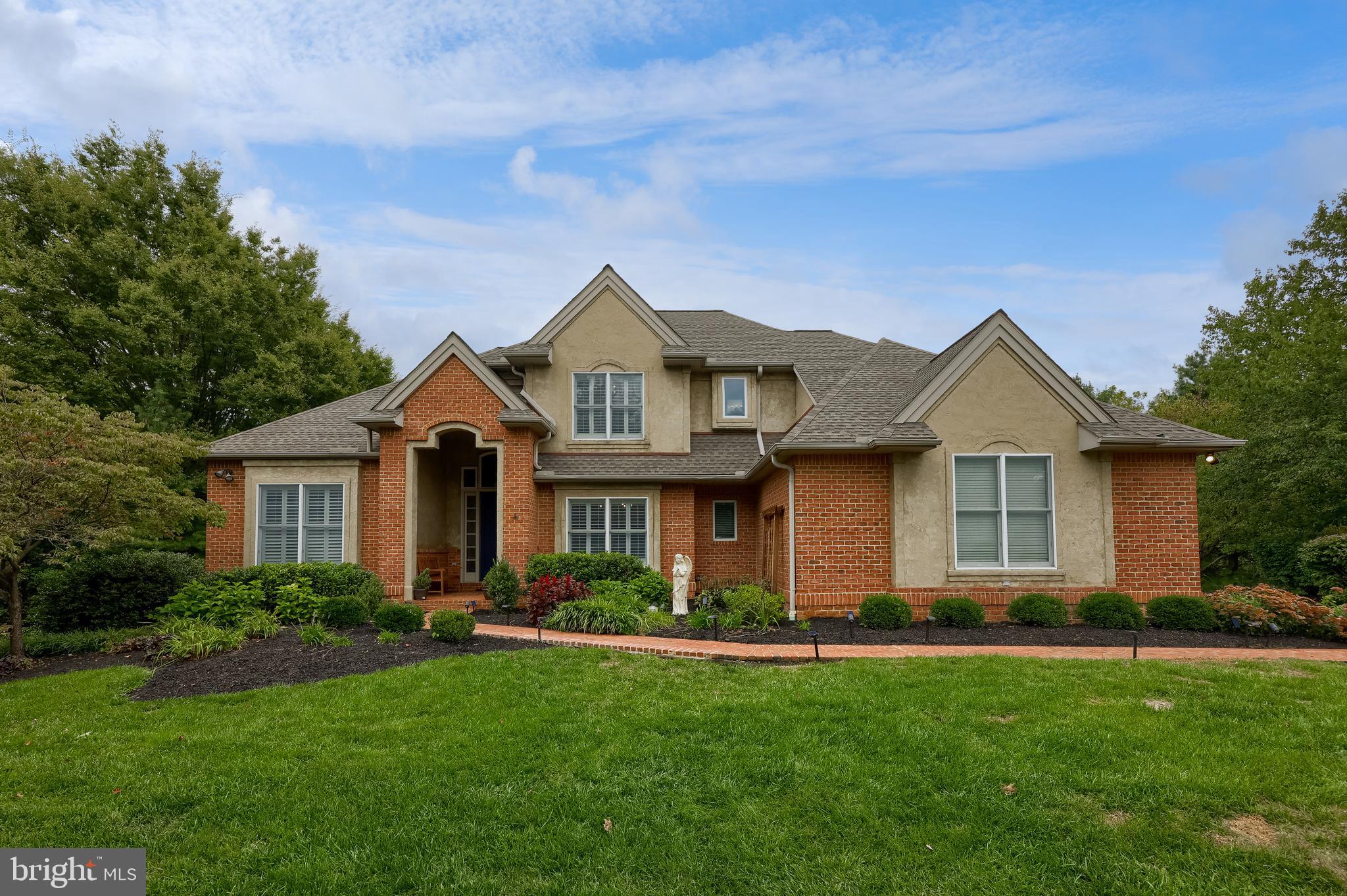 Discover unparalleled elegance and space in this stunning two-story home, perfectly situated on a serene, nearly one-acre lot in the highly sought-after Mondamin Place neighborhood. With over 5,000 square feet of living space, this residence offers the ultimate blend of luxury, comfort, and convenience, just minutes from major highways, top-rated schools, shopping, parks, and dining.
As you step into the bright, two-story foyer, you are greeted by gleaming hardwood floors and high ceilings that flow seamlessly throughout the main level. Entertain with ease in the formal dining room, adorned with an elegant tray ceiling. A large, first-floor office provides the perfect quiet retreat for working from home. The heart of the home is the spacious great room, featuring a cozy gas fireplace, and the incredible chef's kitchen. Here, you'll find extensive granite countertops, pantry space, updated stainless steel appliances, and a sunny breakfast room.
Retire to your private first-floor primary suite, a true sanctuary with tray ceilings, a walk-in closet with organization system, and additional closets. The spa-like ensuite bathroom offers vaulted ceilings and comes complete with a relaxing whirlpool tub, a separate tile shower, and direct access to the expansive covered rear deck.
Upstairs, three additional spacious bedrooms await. One bedroom boasts a private en suite bathroom and walk-in closet, while two others—one featuring beautiful hardwood floors and a vaulted ceiling—share a convenient Jack and Jill bathroom.
The fantastic finished daylight lower level is an entertainer's paradise, featuring a huge living room with a kitchenette, a fifth bedroom with a full private bathroom—ideal for guests or in-laws—and ample storage space.
Outside, your private oasis awaits. Enjoy countless hours relaxing or hosting on the large covered deck and lower-level patio, overlooking your spacious and private yard. A 3-car garage provides abundant parking and storage for all your needs.