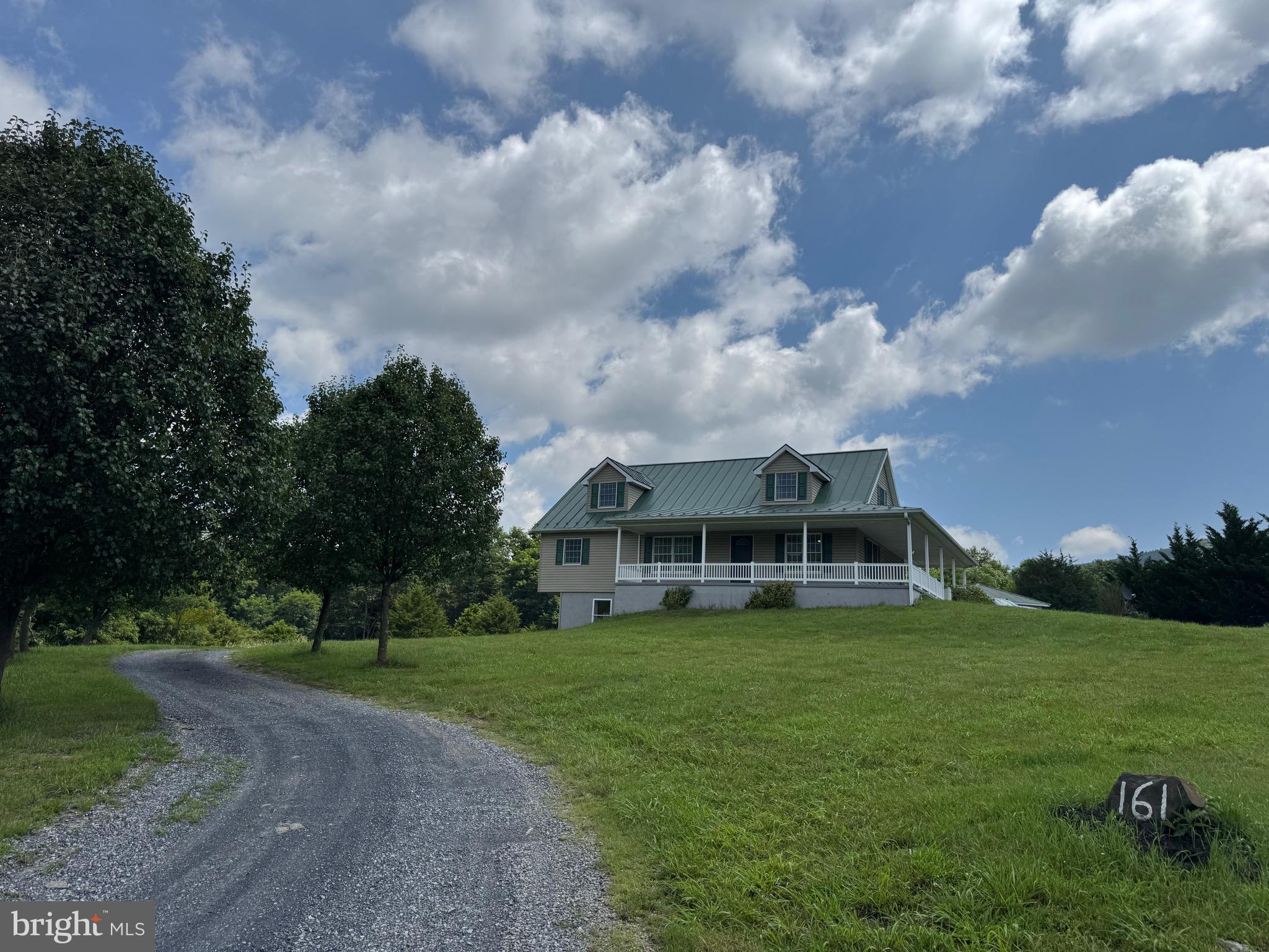 West Virginia Living at its finest! This charming cape cod features stunning mountain views that create a serene and inspiring backdrop for everyday life! Imagine waking up to those stunning vistas each morning or relaxing on the porch while appreciating the natural beauty surrounding this home. With shared access to George Washington National Forest there is no end to the amount of nature and beauty you will experience here. All this alure and we haven't even stepped inside this inviting home with 3 bedrooms and 2 baths upstairs it also features a fully finished basement. With a full second kitchen and bath in the basement this is the perfect place for entertaining, guest accommodations, or multigenerational living.