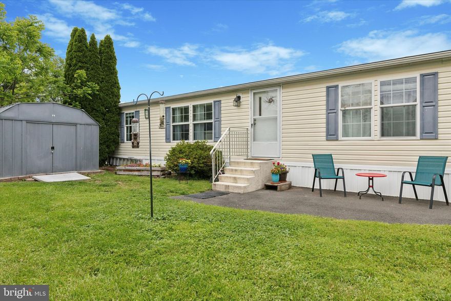 Nestled in the sought-after Colonial Heritage community of Doylestown, this spacious double-wide manufactured home offers modern comfort and convenience in a prime location. Built in 2010, the home features an open floor plan with three bedrooms and two full bathrooms, making it ideal for families or those seeking single-level living. The modern kitchen boasts stainless steel appliances, a wine fridge, and newer flooring that extends into the living and dining areas, creating a cohesive and stylish living space. The master suite includes a double vanity, a large soaking tub, and a separate shower, providing a private retreat within the home. Additional amenities include a laundry room off the kitchen and an outdoor storage shed.

Located within the Central Bucks School District, residents benefit from access to top-rated schools. The community's prime location offers easy access to shopping and dining options, including the new Whole Foods and Target. The monthly lot rent covers trash pickup, water, sewer, and snow removal, while residents are responsible for lawn maintenance, electric, and propane. Colonial Heritage is an all-ages, pet-friendly community with amenities such as a community center and nature trails, providing a welcoming environment for all residents.