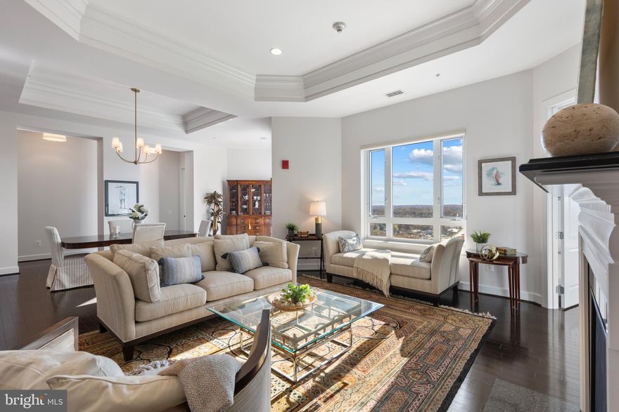 Welcome to GrandView, one of the most sought-after and luxurious locations in Annapolis! This exquisite 12th-floor penthouse offers the epitome of condo living with over 2,600 square feet of elegant space and expansive views. The spacious “Innsbrook” model is one of the largest units in the building, featuring 3 bedrooms and 3 bathrooms. The third bedroom could also be an office or separate den. 

With breathtaking, panoramic views from every room, you'll enjoy the changing seasons in style. This home is also equipped with a brand-new HVAC system, brand-new LG Washer/Dryer, upgraded lighting, 11Ft Ceilings, Rare Fireplace (Exclusive to the 12th floor), walk in-closets, separate laundry room, hardwood flooring, a large storage unit and two parking spaces.

The Towne Centre offers a vibrant mix of exclusive name-brand stores and top-tier amenities, including Whole Foods, Sephora, Restoration Hardware, LifeTime Fitness, TruFood Kitchen, Tatte Bakery, and more, all within walking distance. Enjoy the ultimate "lock-and-leave" lifestyle with access to GrandView's impressive amenities, including concierge service, a rooftop pool with BBQ area and outdoor shower, a state-of-the-art fitness center, social rooms, a bar/lounge, and a library. The building also offers covered garage parking and Tesla charging stations. 

With easy access to commuter routes and nearby marinas, this location is a haven for shopping, dining, and entertainment. Plus, vibrant community events are just outside your door!