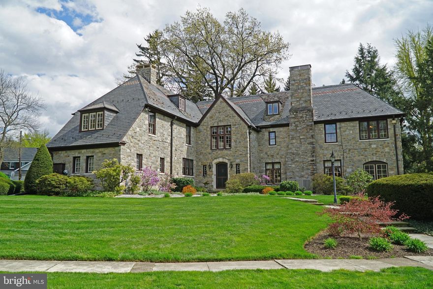 This is a rare chance to own a piece of York County History!  This prestigious stone manor house was built in 1929 by local businessman Henry D. Schmidt in the Norman style.  You will love the gorgeous newer Peach Bottom slate roof with Vermont trim, and the beautifully landscaped .95 acre lot in historic Springdale, just a short walk to York Hospital, Penn State York and York College of PA.  An impressive residence of over 5000sf, its understated elegance is perfectly balanced with an inviting and warm atmosphere and functional layout. This opulent home offers 5 bedrooms, 4-1/2 baths, striking original architectural features and many recent updates. The grand two story foyer with flagstone vestibule and open staircase is flanked by the formal dining room, huge living room with gas fireplace, study, and a cozy Den opening to the patio and pond. The renovated kitchen offers granite counters, stainless steel Viking double oven, as well as a wonderful butler's pantry with original cabinetry and sink connecting the kitchen and dining room areas.  The second floor of the home features three generous bedrooms, each with a private bath. The owner's suite also includes a private office and walk-in closet. A second staircase leads to a separate wing of the house which includes 2 additional bedrooms, a full bath, and access to the partially finished third floor, which includes office/bonus room, newly remodeled 5th full bath & huge unfinished/storage area. In addition to its many charms, the home has been enhanced with a whole house generator, 400 amp electrical service, recently installed HVAC system, greenhouse, ADT security system, two car garage and large driveway with ample parking. Add the private, fenced backyard, picturesque neighborhood of many historical homes, and a central location close to major arteries, professional districts and cultural attractions, and you have a showcase home!