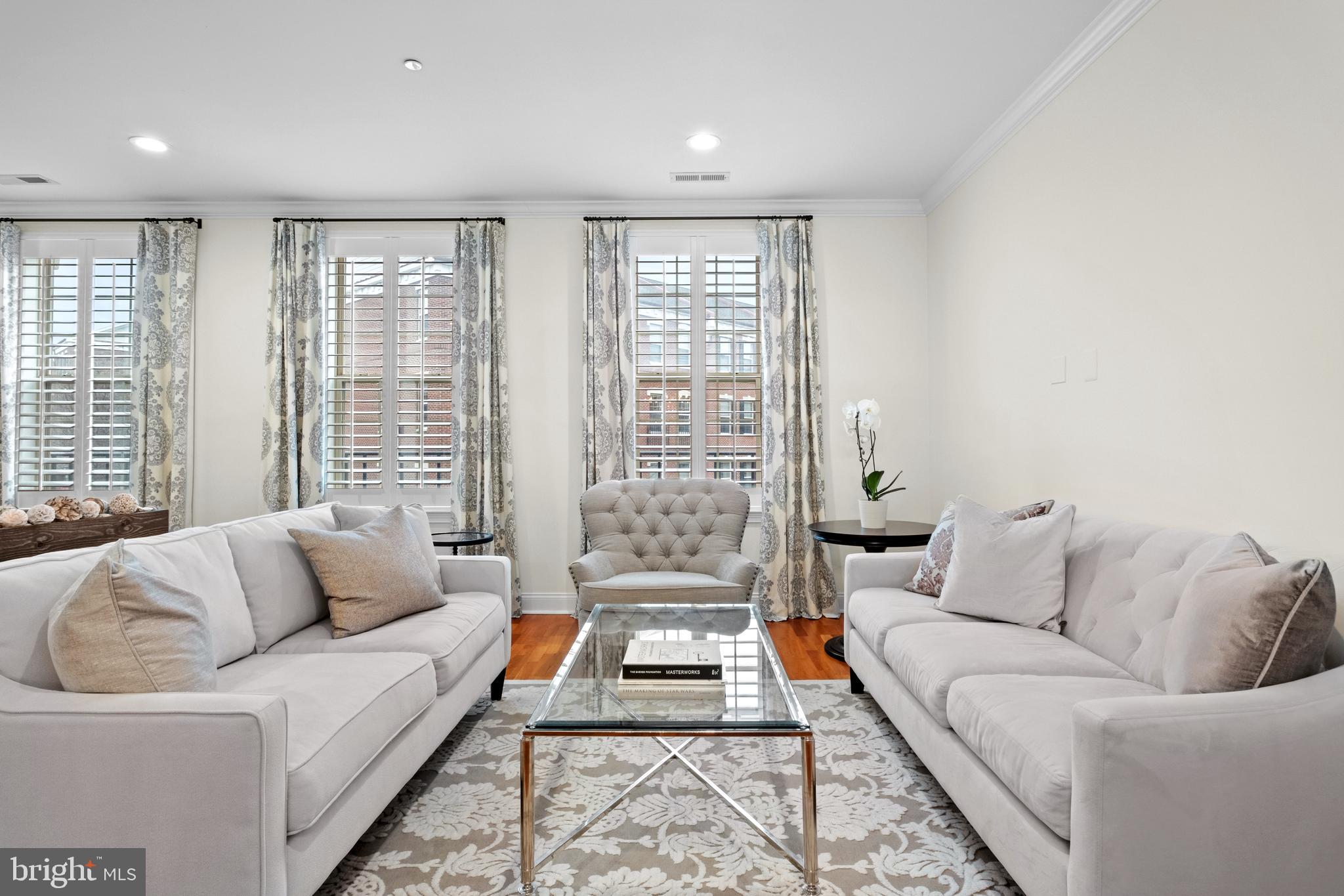 Introducing a magnificent townhome that encapsulates luxury living in the heart of Philadelphia!  Ideally located in a prized, gated enclave just south of Fitler Square, and only steps to University City, this Naval Square home is exactly what you have been waiting for! 708 Captains Way is an exquisite bi-level townhome boasting 4 bedrooms, 2 full baths, 2 half baths and a deeded parking space! As you step inside this pristine home, you'll immediately notice the care and dedication the owners have put into both updating and maintaining this lovely home. The location of 708 is prime— uniquely positioned and nonadjacent to other townhome buildings — this home offers unmatched privacy and seclusion, in addition to affording it an abundance of natural light! On the first level, you will be welcomed into a spacious open concept living/dining area with gorgeous cherry hardwood flooring, freshly painted walls and upgraded recessed lighting. Next, flow seamlessly into the well designed kitchen with professionally refinished white shaker-style cabinets, stainless appliance suite, including an LG Counter depth French door refrigerator. Tumbled marble tiled backsplash & sleek granite counters and large pantry complete the space. An adjacent, more casual eat-in-kitchen area is the perfect space to enjoy your morning coffee. The adjoining family room is full of sunshine, and opens to a private terrace spanning the full length of the property. The spacious terrace embraces beautiful treetop views and a stunning vantage of the nearby Roberts Center. On the second level, you will find an elegant primary suite with vaulted ceilings, upgraded hardwood flooring, and a luxurious walk-in-closet, completely outfitted with gorgeous custom built-ins by Closets by Design. Luxe ensuite bath features upgraded dual sinks, granite tops, soaking tub & separate shower with frameless glass enclosure. On this level, you will also find two additional sunlit bedrooms, full bath, and laundry closet with built-in cabinets and a newer side-by-side LG washer & dryer (2024). Just when you think you have seen it all- there is an entire additional level! The recently finished basement boasts a 4th bedroom with a large window, PLUS a nice sized den/ study and a beautiful 2nd half bath. Tucked away under the stairs you will find TWO spacious storage closets with practical storage solutions. Enjoy neutral paint, newly carpeted stairs to the basement, upgraded light fixtures & bathroom hardware, and beautiful plantation shutters throughout the entire home. Have peace of mind knowing that the hot water heater was replaced in 2021 and there are two HVAC units (lower unit is original and upper unit was replaced in 2022). Smart home features include: one Nest thermostat. Deeded pull-in parking space (700 Captains Way Unit #P359) is just steps from the home.Â
Enjoy the ease of having the pool & state-of-the-art fitness center less than a minute walk from your building and the concierge close by. The dramatic community room in Biddle Hall rotunda is perfect to reserve for private parties. Enjoy the outdoor amenities of the 20-acre park-like setting: including picnic areas, well-kept gardens & mature landscaping. With a gated entry and on-site visitor parking, convenience and security are paramount. Very close proximity to South Street Bridge, UPenn (0.7 mi), CHOP, HUP & Drexel, Rittenhouse (0.9 mi) & Fitler Square. Fantastic restaurants and cafes, such as Rival Bros Coffee, Friday Saturday Sunday (James Beard Winner), Illata BYOB, Pub & Kitchen, Southgate, Sabrina's & Loco Pez, are all just steps outside the gates. The new Heirloom Market by Giant and South Square Market are only a block away. Directly out the back gate you will find easy access to the Schuylkill River Park, including the Award Winning Trail & Boardwalk, Markward playground, Tennis Courts & dog park!