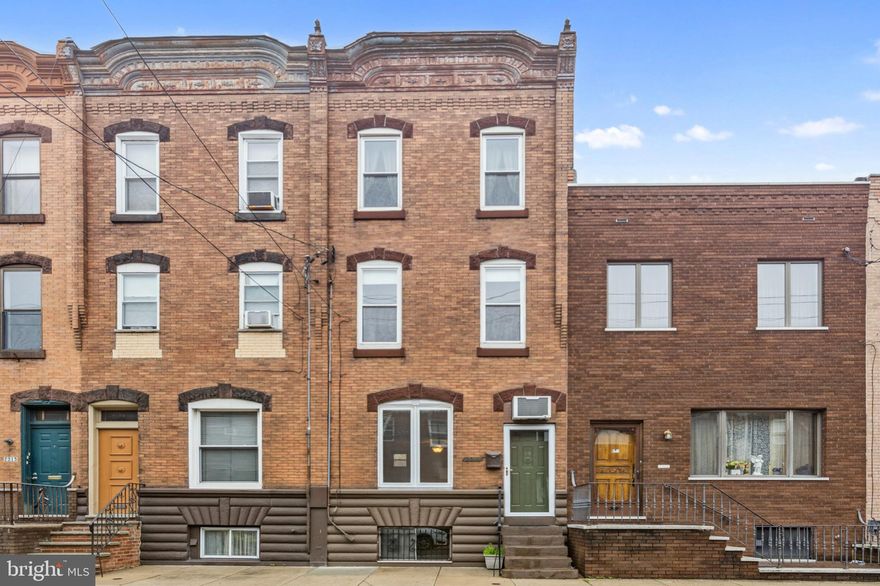 Incredible opportunity to own a rare 3-story home near Broad Street in the coveted Melrose section of South Philadelphia!   Just three blocks north is the popular East Passyunk corridor, lined with a diverse array of restaurants and boutique shopping.   Three blocks south is Marconi Park, a lovely area for children and dogs to play.   And located steps from the Broad Street Line, taking you into center city or the sports stadiums.  2319 S 15th Street is a stunner with its original brick facade and detailed accents.   Enter into a spacious open main floor lined with hardwood and leading back to the large eat-in kitchen with retro wooden cabinetry, vintage wall oven, cooktop, and stainless steel French door refrigerator.  They just don't make them like this anymore!   The back patio provides an additional area to catch some rays and relax outdoors.   The second floor offers three bedrooms and one full bathroom.   One of the bedrooms currently hosts the laundry area.   The third floor offers an additional two bedroom and second full bathroom with retro style tiling.  One of the bedrooms currently hosts a functional kitchenette with vintage gas range and sink.   The third floor also provides exterior access to the lower roof, which can be converted into a roof deck with beautiful city views!   The basement is unfinished, but full sized for an abundance of storage options.   It also includes a functional half bath area that can be finished off in the future.   This home is move-in ready but offers plenty of value add opportunity so that you can make it your own.   This is truly a home that you can grow into and enjoy for many years to come.   Properties like this do not pop up often in this amazing location.   Schedule your showing today!