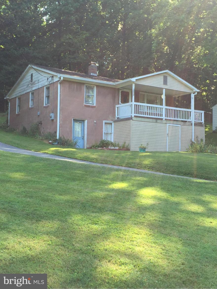 This home sits on a nice lot with a circular driveway and mountain views. Large living room and kitchen. wood floors. furnace only about 12 years ago, roof about 10 years old, HWH replaced in '08.  Great house.  Just needs some updates.  Estate Sale.  Sold AS-IS.  Any lender required repairs (peeling paint, etc.) at the expense of the buyer prior to settlement.