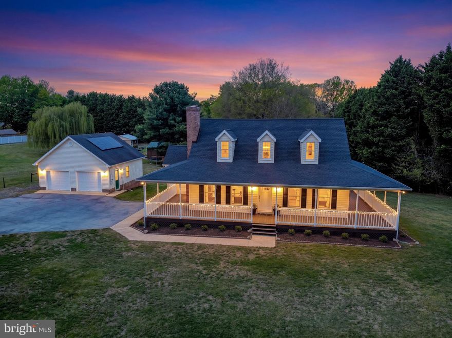 Escape to your own private Farmette paradise!  This charming home perfectly blends character with thoughtful modern upgrades, offering the ultimate blend of simple country living and amenities.  Step outside and immediately feel at home on the inviting covered wrap-around porch - the perfect spot to enjoy your morning coffee, watch the sunset, or simply soak in the peaceful surroundings.  Just beyond lies an incredible outdoor oasis featuring a sparkling in-ground gunite pool, a large remodeled 14'x30' back deck with all new composite railings, with sweeping views over the pool and patio area, and plenty of space for entertaining.  For the hobby farmer or animal lover, this property truly shines: a horse run with three stables complete with electrical and water, a huge flat and fully fenced pasture, and multiple outbuildings provide endless possibilities.  Bring your horses, goats, chickens, or livestock - or simply enjoy the space for gardening, play, or peaceful relaxation.  One of the horse stalls is currently used as a chicken coop - that can house up to 30 chickens!  The picturesque pasture is anchored by a stunning weeping willow that adds graceful beauty to the landscape.  Enjoy picnics on the table under the weeping willow all spring and summer long!  Car enthusiasts will love the 26'x28' detached garage or the endless storage options and versatility. Inside, the home is equally impressive.  The kitchen has been completely remodeled with 42" cabinets, a decadent Glass Mosiac backsplash by Elida, new countertops, and new stainless steel appliances.  Original hardwood floors in the living and dining areas preserve the home’s authentic character and warmth, beautifully complemented by elegant new Pottery Barn lighting fixtures.  The main-level master suite offers convenient access directly from the wrap-around porch, double closets, and a beautifully updated private bath.  The master bath shines with 60'' Double Bathroom Vanity with Marble Top the gorgeous new renovated shower with Calacatta Marble Tile.  Upstairs you’ll find two spacious bedrooms and a newly renovated full hall bath.  New luxury vinyl plank (LVP) flooring flows throughout the main-level master, upstairs, and basement for durability and style.  The finished walk-out basement opens directly to the pool area and includes a flexible recreation space, an additional bedroom, and a bonus room perfect for a home office, gym, or guest suite. Whether you’re looking for a peaceful country retreat, a hobby farm, or a unique home packed with lifestyle amenities, this property checks every box and then some.  Recent upgrades include: new Thompson Creek roof with 50-year "No-Hassle" transferable warranty, new Energy-Efficient HVAC, remolded kitchen (2026), renovated master bathroom (2026), renovated upstairs bathroom (2025), Solar City Solar Panels, LVP Flooring throughout (2025), Gunite Pool was re-tiled (2024).  Don’t miss your chance to live the good life — simple, upgraded, and wonderfully complete.