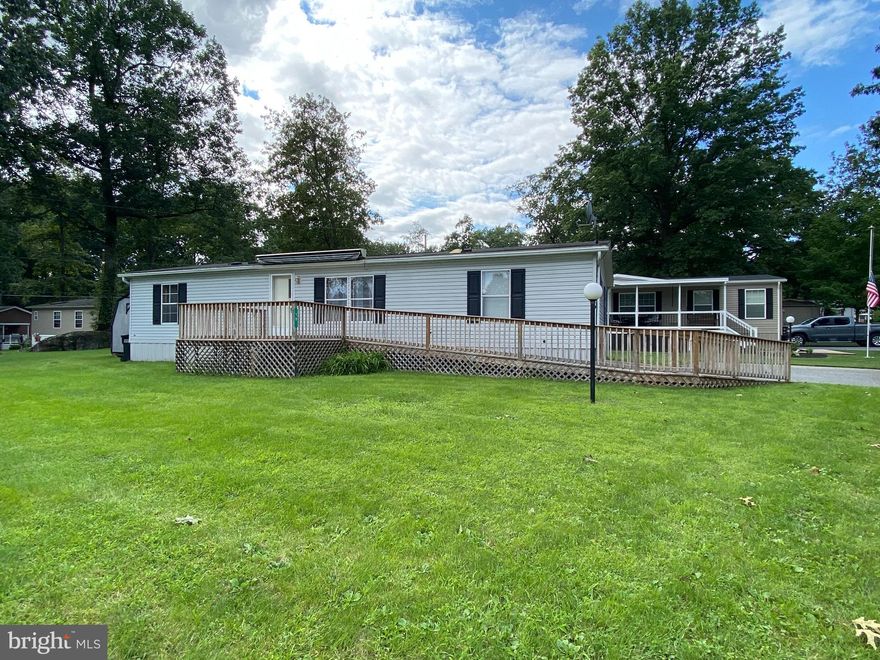 Nice 3 bedroom, 2 bath,  Liberty mobile home in one of Lancaster County's nicest communities.  This home 
 is a Liberty is 27' x 52' and was built in 1996 and has been well cared for.  Newer carpeting throughout except the primary bedroom.  Roomy eat in kitchen as well as a formal dining area.  The primary bedroom could be set up in such a way that the adjoining den would be perfect for a nursery or home office.  Large pantry off the dining room offers great storage.  Newer HVAC system provides economical heating and cooling.  There is a wonderful deck with ramp that is perfect for evening gatherings.  Be sure to add this to your next tour list!