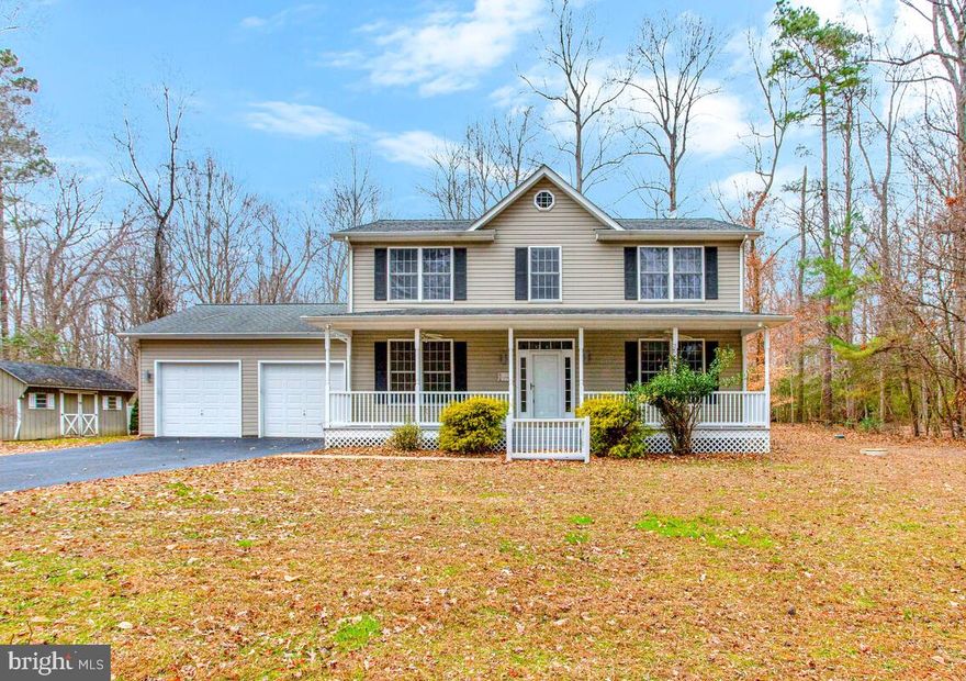 Beautiful 5-bedroom, 3.5-bath home set on a spacious lot backing to a state park, offering privacy, scenic views, and exceptional versatility. The open-concept floor plan features hardwood floors, granite countertops, stainless steel appliances, and a gas fireplace that adds warmth and charm to the main living area. The finished basement provides additional space for entertaining, recreation, or guests.

Outdoor living is enhanced by a large, partially covered deck with a fire pit—perfect for relaxing or hosting gatherings. Recent upgrades include a new HVAC system and water softener (2025), along with heated floors in the upstairs bathroom for added comfort.

The property also features a two-car attached garage plus a detached three-bay garage equipped with a new mini-split system, ideal for a car enthusiast, workshop, or potential rental opportunity. Backing to protected parkland, this home offers a rare blend of privacy, functionality, and modern convenience.