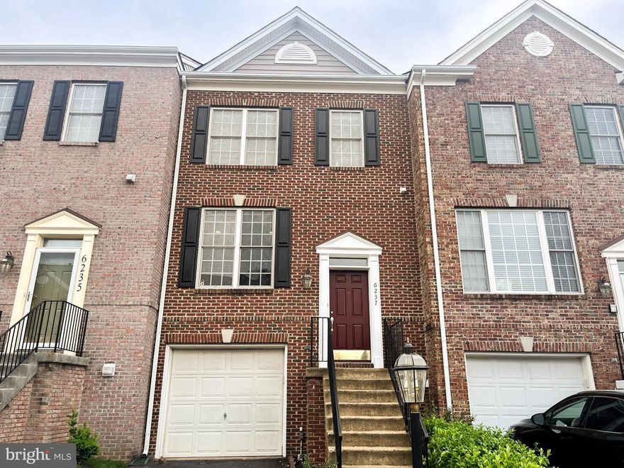 Welcome to this beautifully updated townhome in the prestigious gated golf community of PIEDMONT in Haymarket, VA, where everyday living feels like a RESORT-STYLE EXPERIENCE. Step inside to rich 6-inch-wide maple hardwood floors flowing through the main level, all stairs, and upper level — a level of quality rarely found in townhomes at this price point. The main level features an open layout with crown molding, recessed lighting, and well-appointed kitchen with updated countertops, stainless steel appliances, subway tile backsplash, under-cabinet lighting, a high-performance range hood, and a large stainless-steel sink. All three full bathrooms were completely renovated with a designer aesthetic — white subway tile, decorative niche accents, natural pebble stone floors, and rain shower heads throughout. The primary bath features dual sinks and a separate soaking tub and shower. The upper hall bath features large step-in shower with glass door. The lower-level bath showcases a sleek linear drain. Three full baths plus a half bath — one more than many comparable homes in the community. The primary suite offers vaulted ceilings and a bright airy feel. All bedrooms include spacious closets and ceiling fans. The walkout lower level adds versatility, and the private patio offers a peaceful wooded view. Southeast-facing rear exposure brings in abundant natural light throughout the day with pleasant shade in the summer afternoons. Additional highlights include freshly painted interior and front door, a large coat closet, guest parking right in front, and HVAC replaced just 3 years ago. Piedmont offers 24/7 security monitored gate access, 2 Outdoor pools, 1 Indoor lap pool, Fitness Center, Tot Lots, Lighted Pickleball and Tennis courts, Jogging Paths, Basketball Court and the 18-hole Tom Fazio designed Championship Golf Course with social and golf memberships available. All just minutes from shopping, restaurants, wineries, breweries, and commuter routes (I-66, Route 29 & 15).