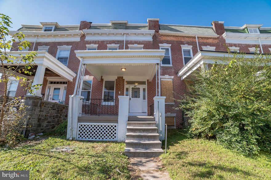 Welcome home to this beautifully updated 4 bedroom 1 bath townhome!  Updates include NEW A/C Unit, NEW  Kitchen, NEW Appliances and Fresh Paint inside and out! Walk into a light and bright hallway with wood floors that flow through out the main level and 2nd level. The living room and dining room both feature ceiling fans and natural light. The kitchen features stainless steel appliances and a gas stove, the butlers pantry includes plenty of cabinet space and the dishwasher. The bedrooms are spacious and include closets. Enjoy original details such as the transfer grilles above the doors and exposed brick that has been painted white.  The unfinished basement is perfect for additional storage.  Easily entertain in the warmer months in the large fenced in back yard. Easy access to 695,  Downtown Baltimore, Shopping and Dining. You do not want to miss this one!