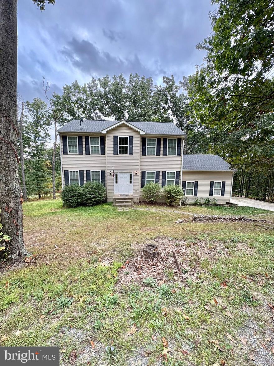 4-bedroom Colonial set on a spacious .52-acre lot! This home features 2 full bathrooms, 1 half bath, and a walk-out basement with a partially finished area—perfect for extra living space or storage. The spacious living room opens to a deck, offering seamless indoor-outdoor living and great views of the backyard. Enjoy evenings around the fire pit or host gatherings in your generous outdoor space. The 2-car garage boasts tall ceilings, ideal for additional storage or a workshop. Roof is just 4 years old! Don’t miss the opportunity to own this charming and functional home! Selling as-is. Needs some cosmetic repairs but otherwise great house at a great price!